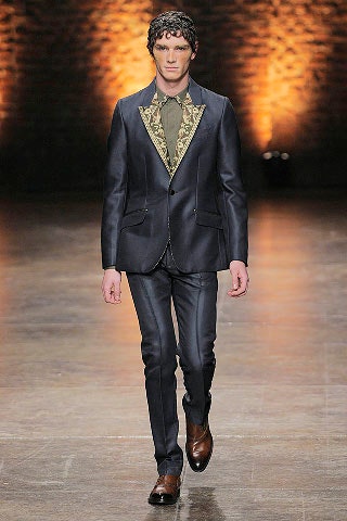 black tailored suit with green shirt