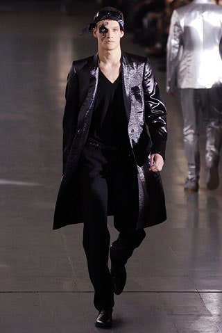 black vinyl coat and slim pants