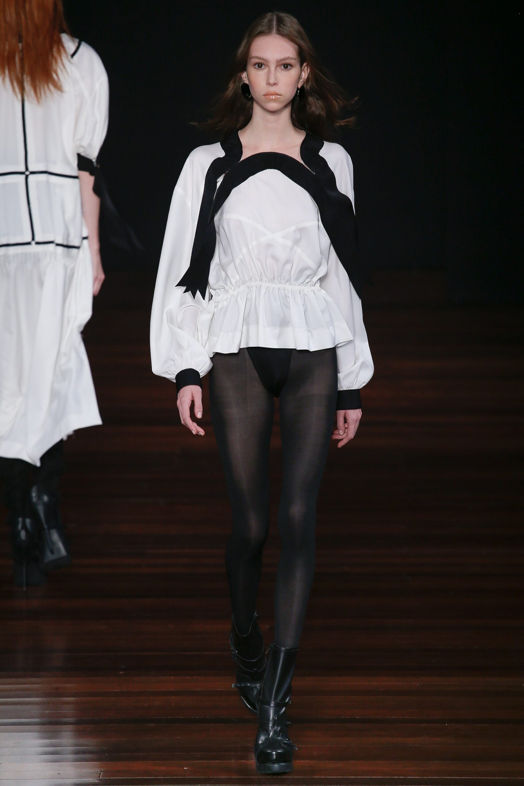 white fitted blouse with black leggings