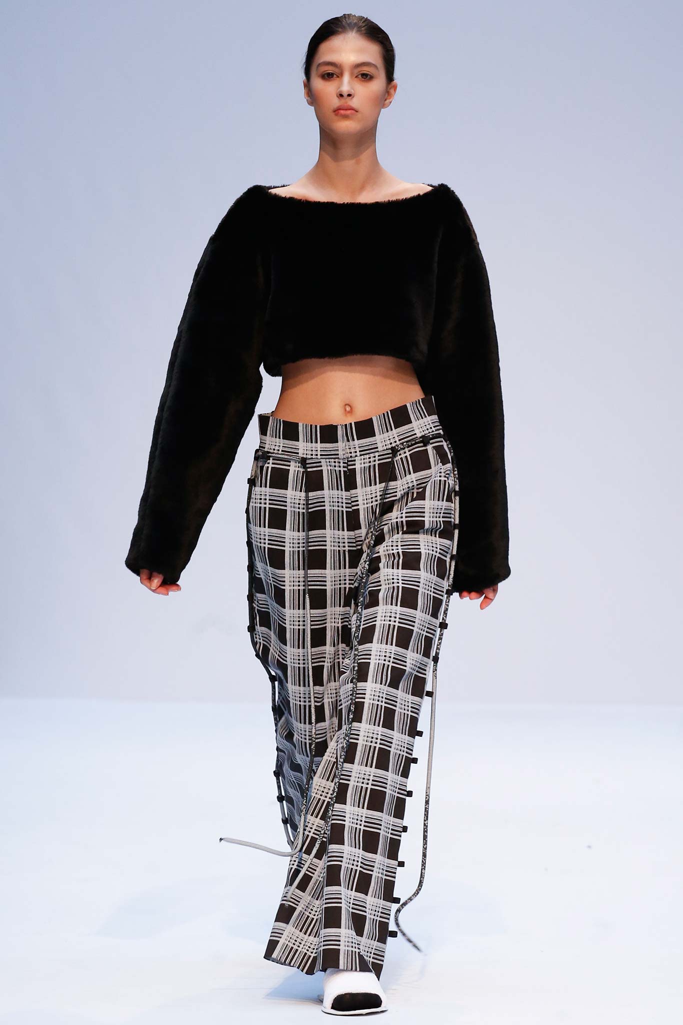 black faux-fur cropped top and checked pants