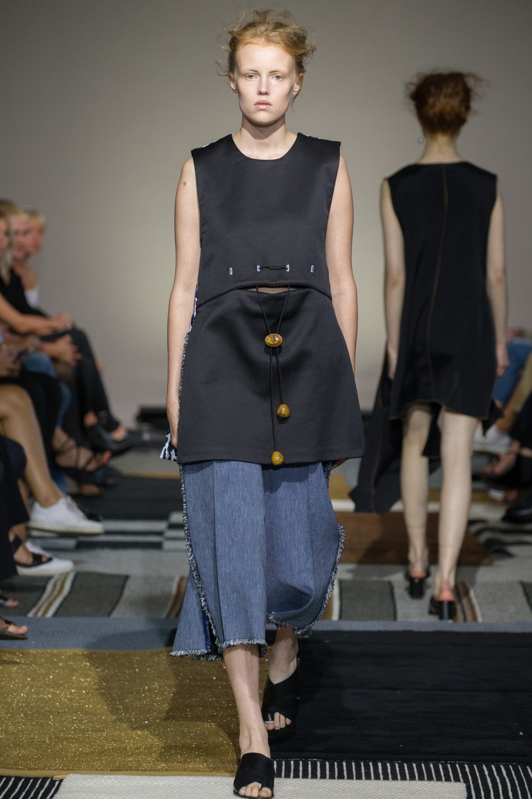 black relaxed top with blue wide-leg pants
