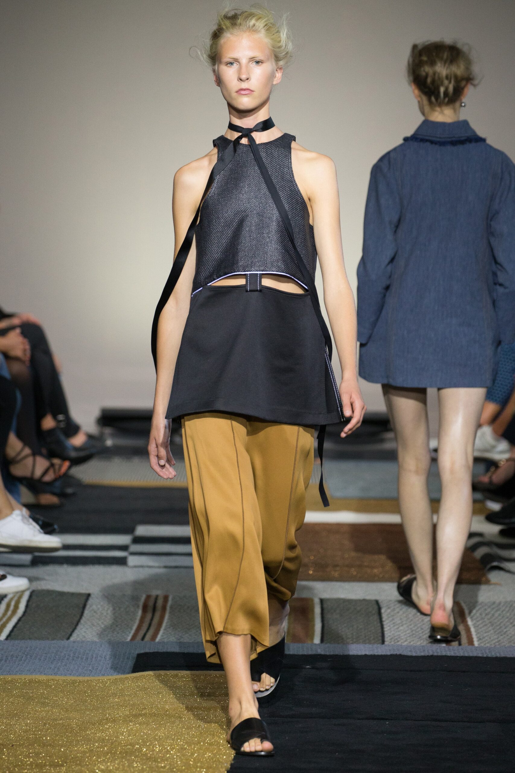 black fitted top and brown relaxed pants