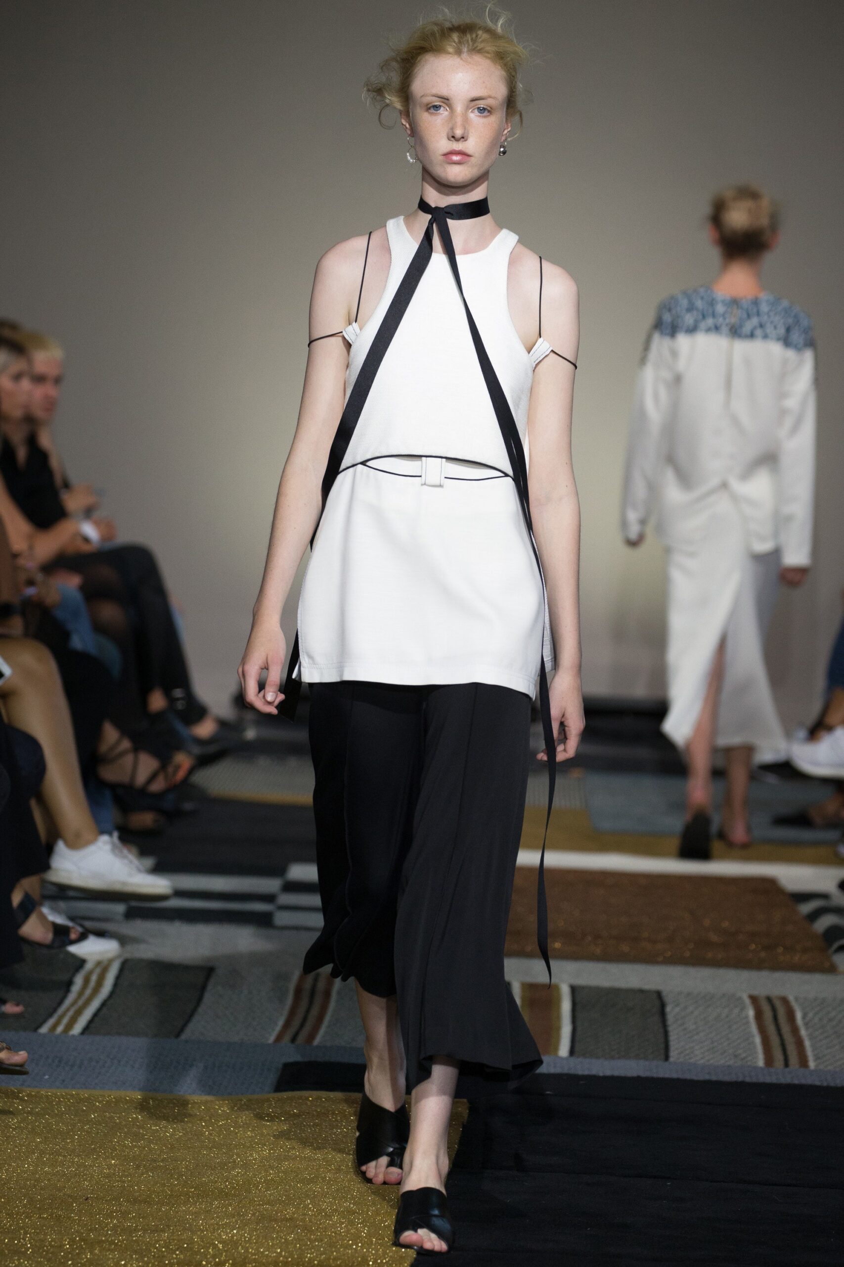 white fitted top with black wide-leg pants