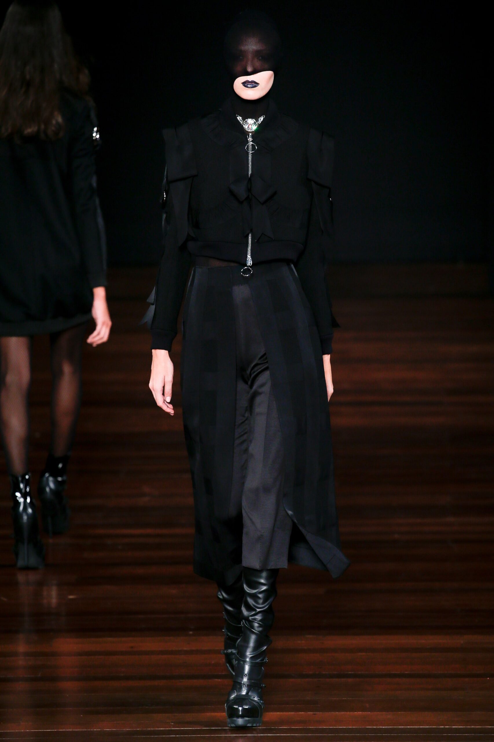 black silk blouse and pleated skirt