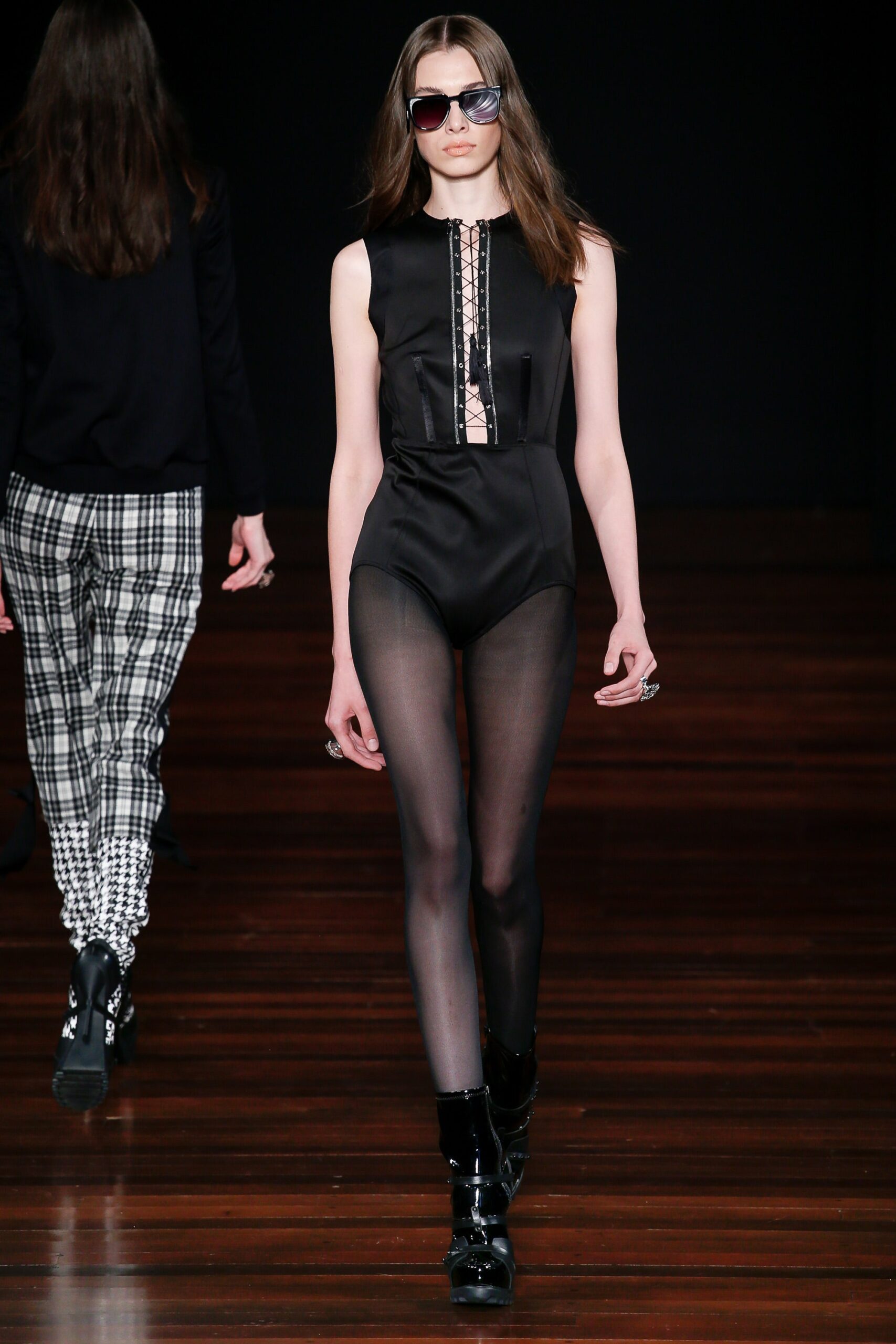 black fitted sleeveless catsuit