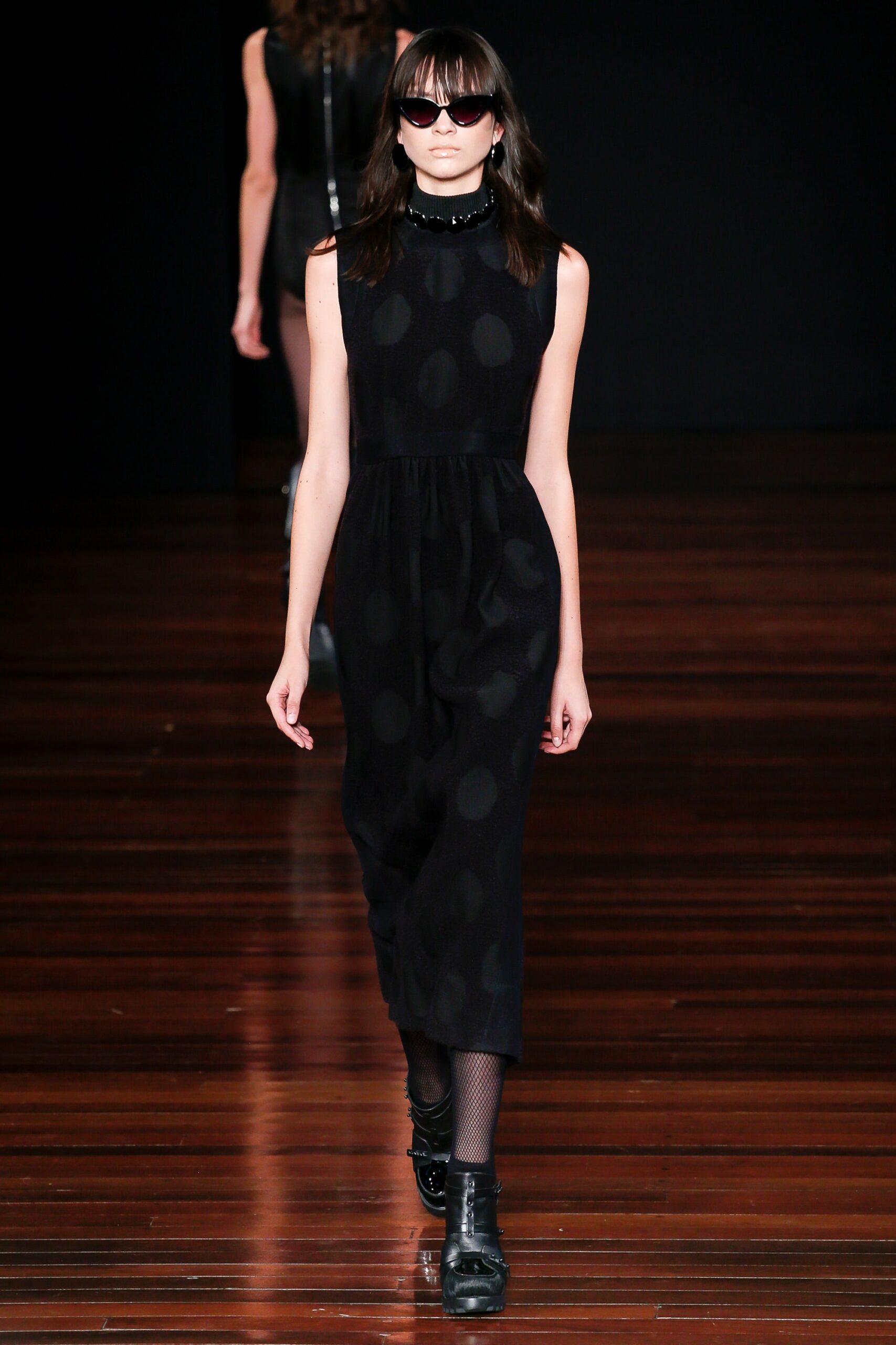 black polka-dot sleeveless dress