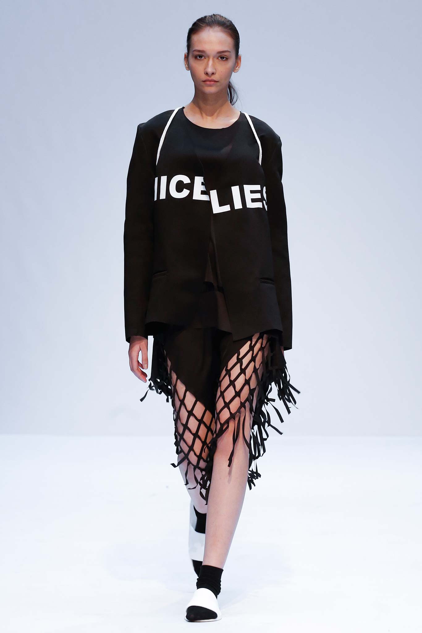black relaxed jacket with fringed skirt