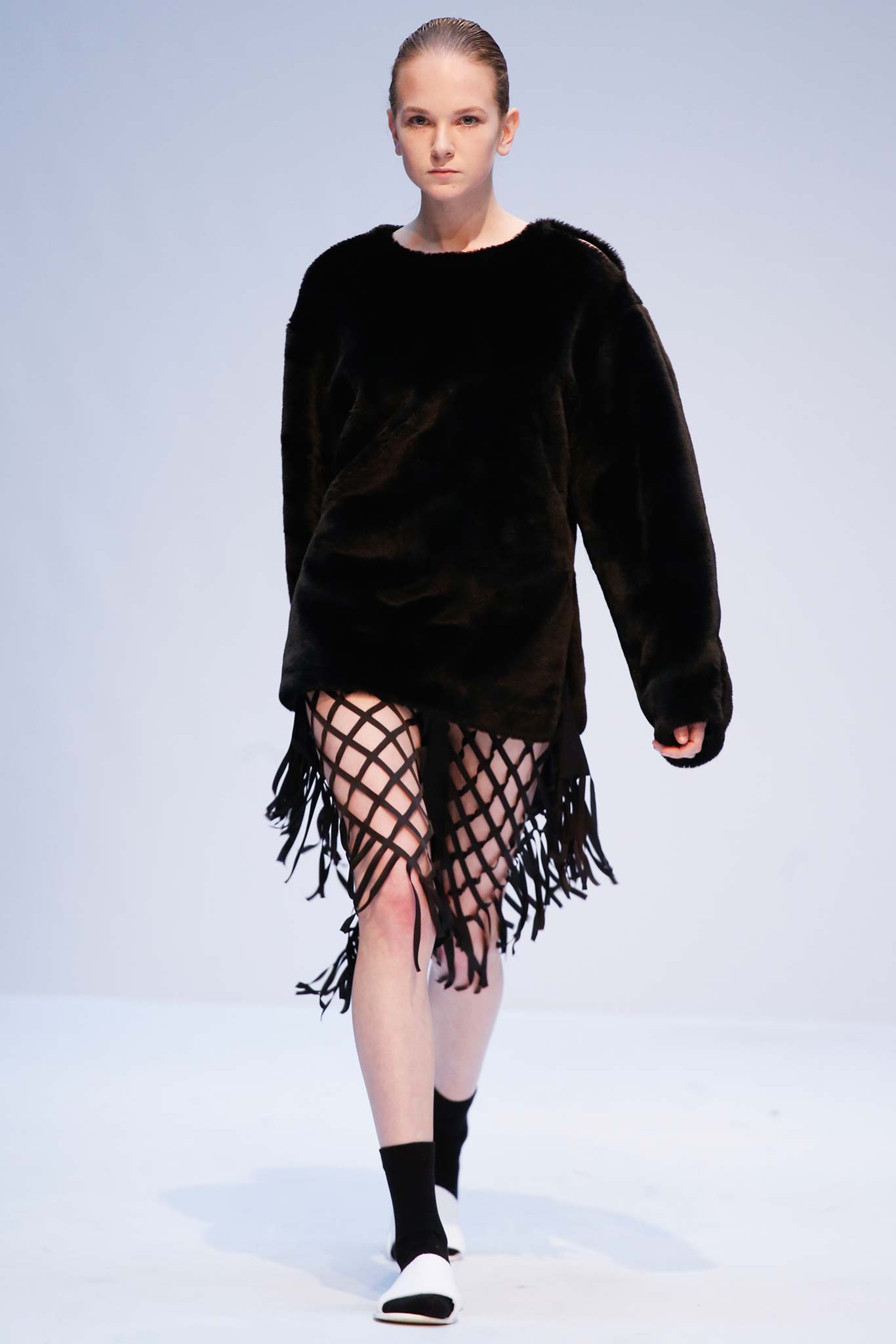 black oversized faux-fur top with fringed skirt