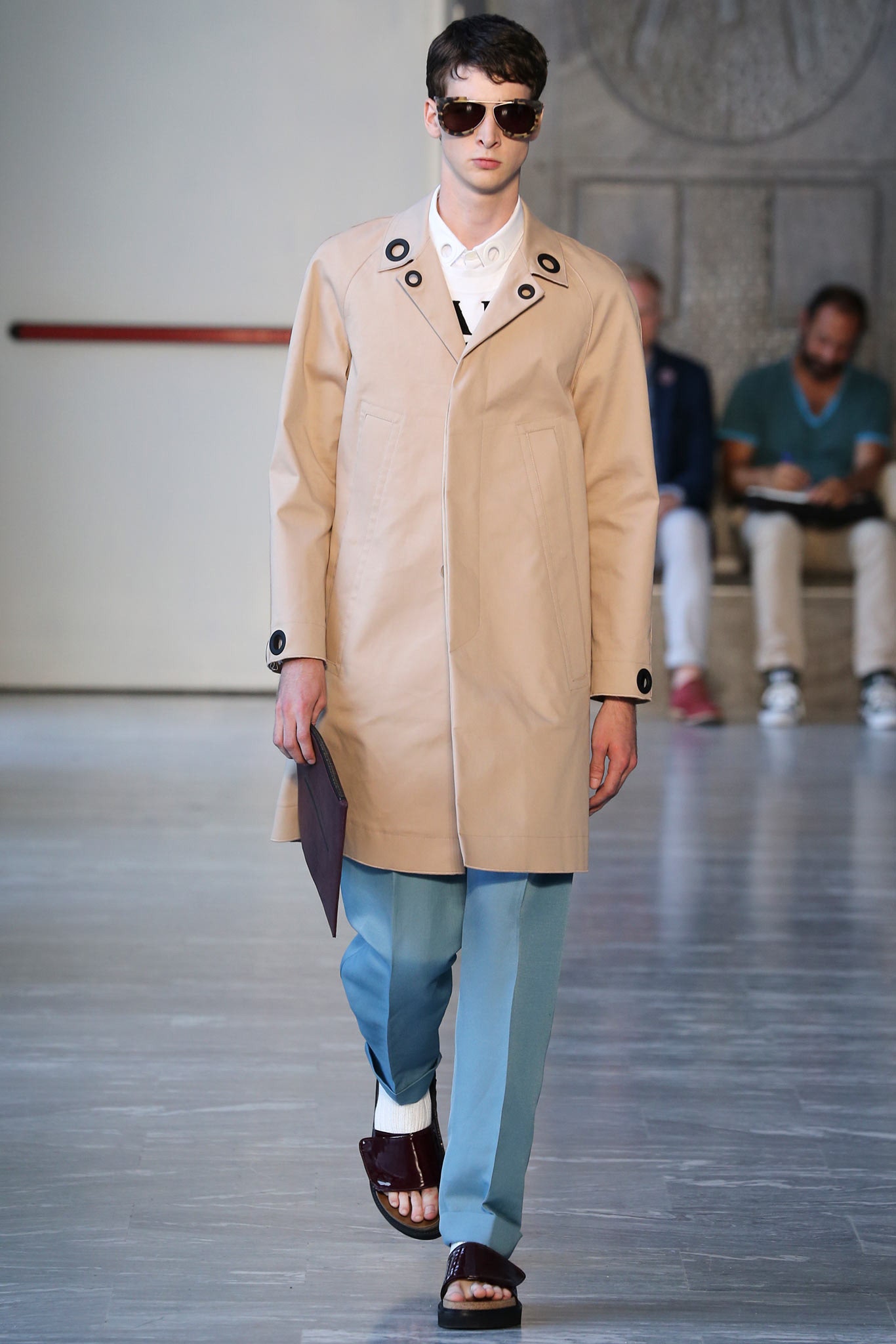 beige coat with blue pants