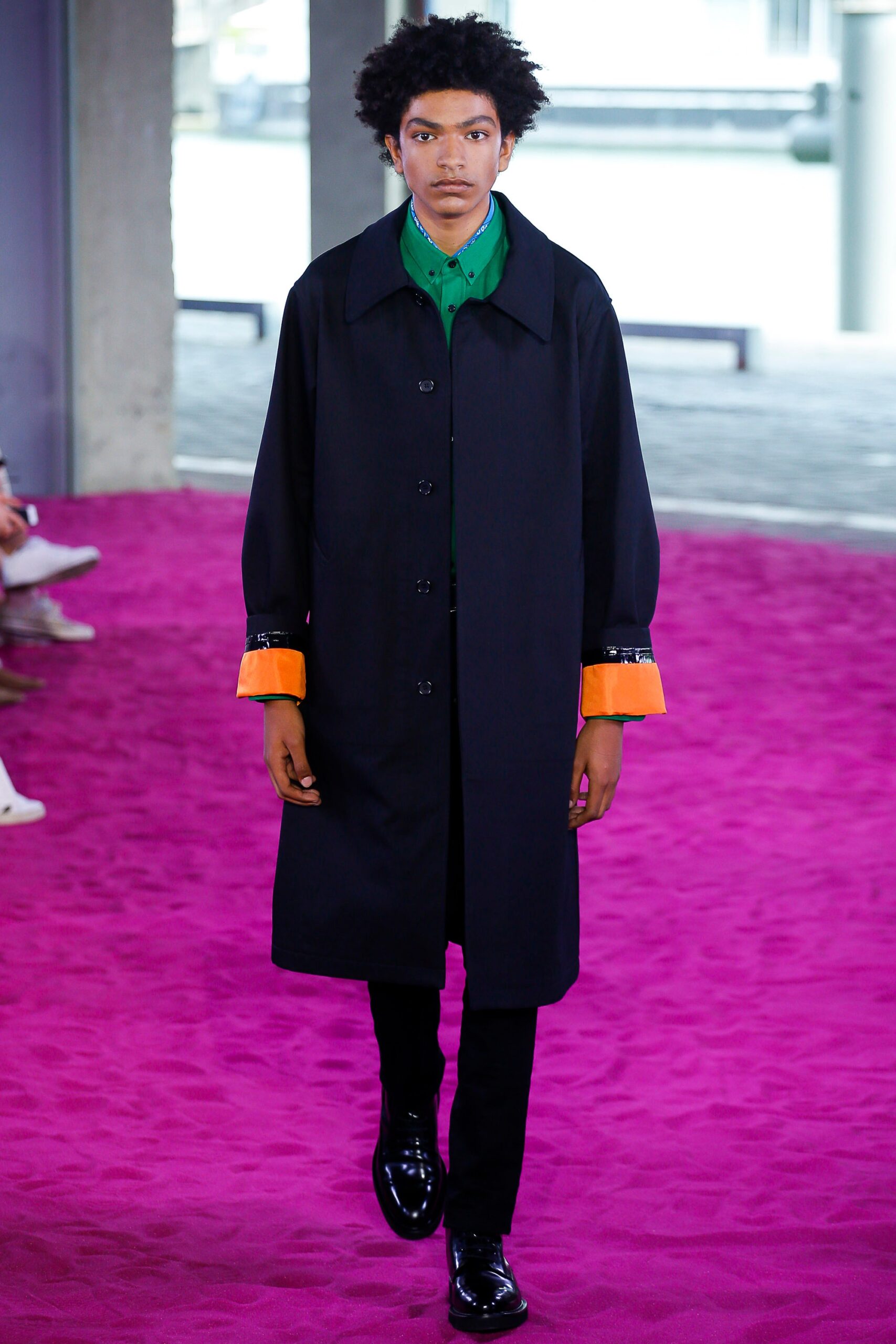 black coat with green shirt