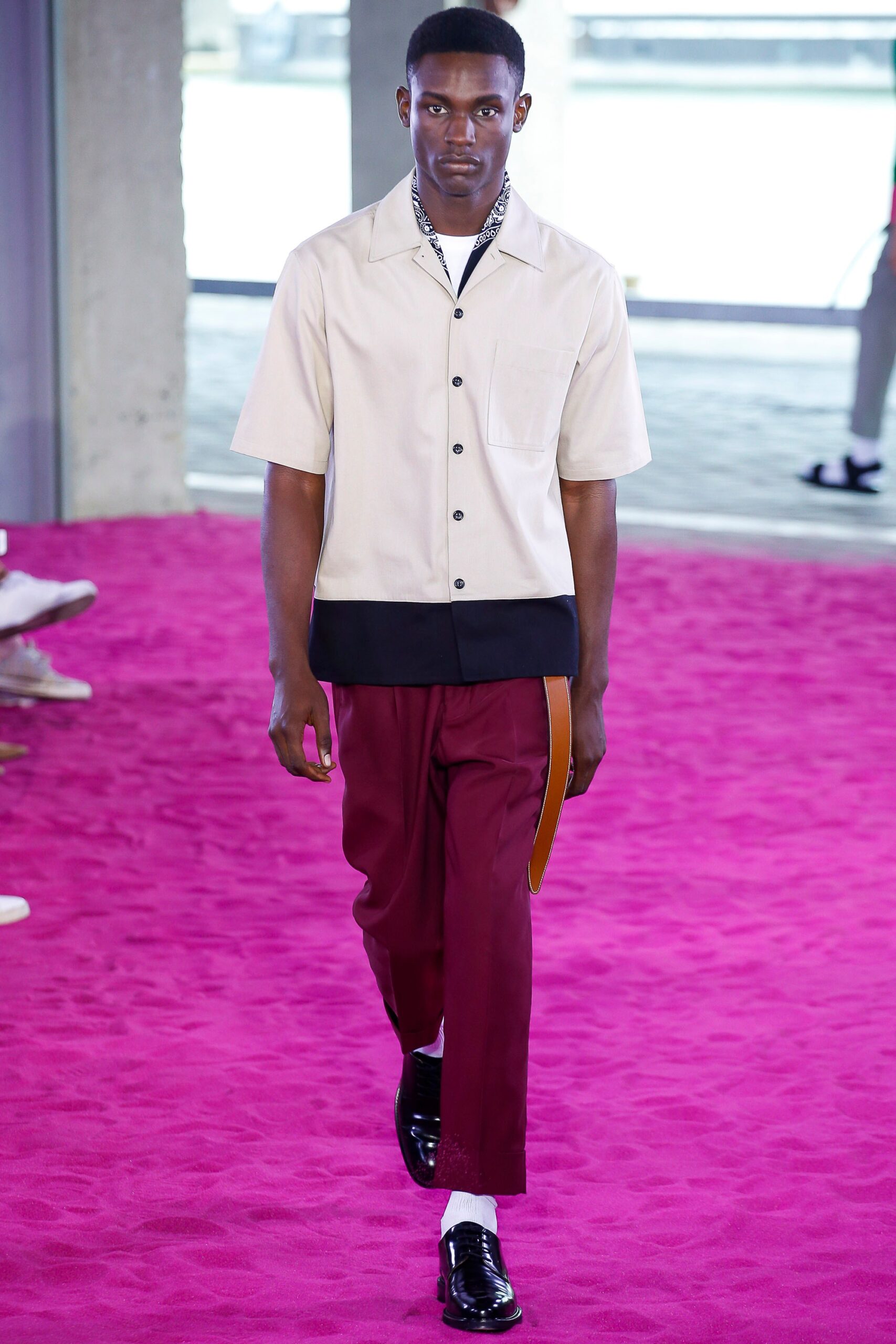 white relaxed shirt with red pants