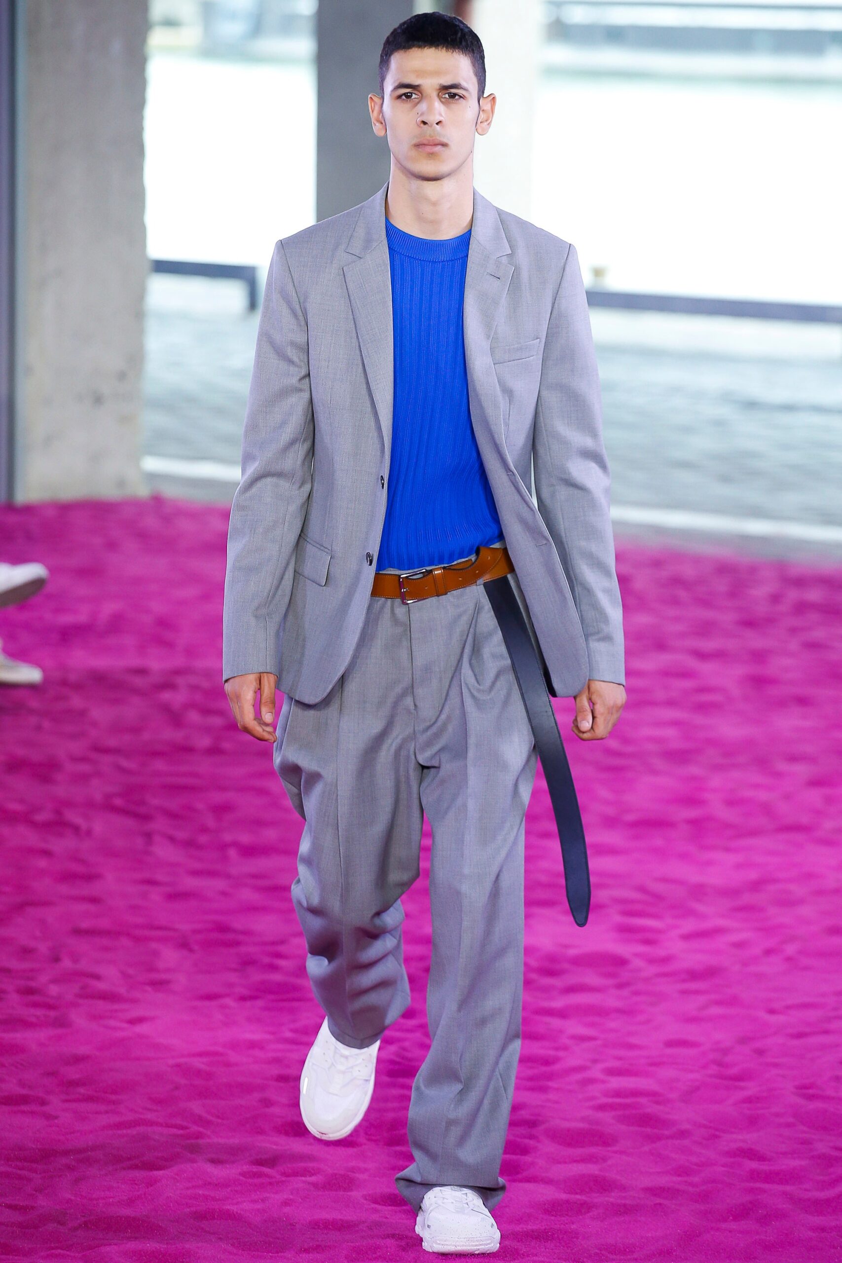 gray tailored suit with blue top