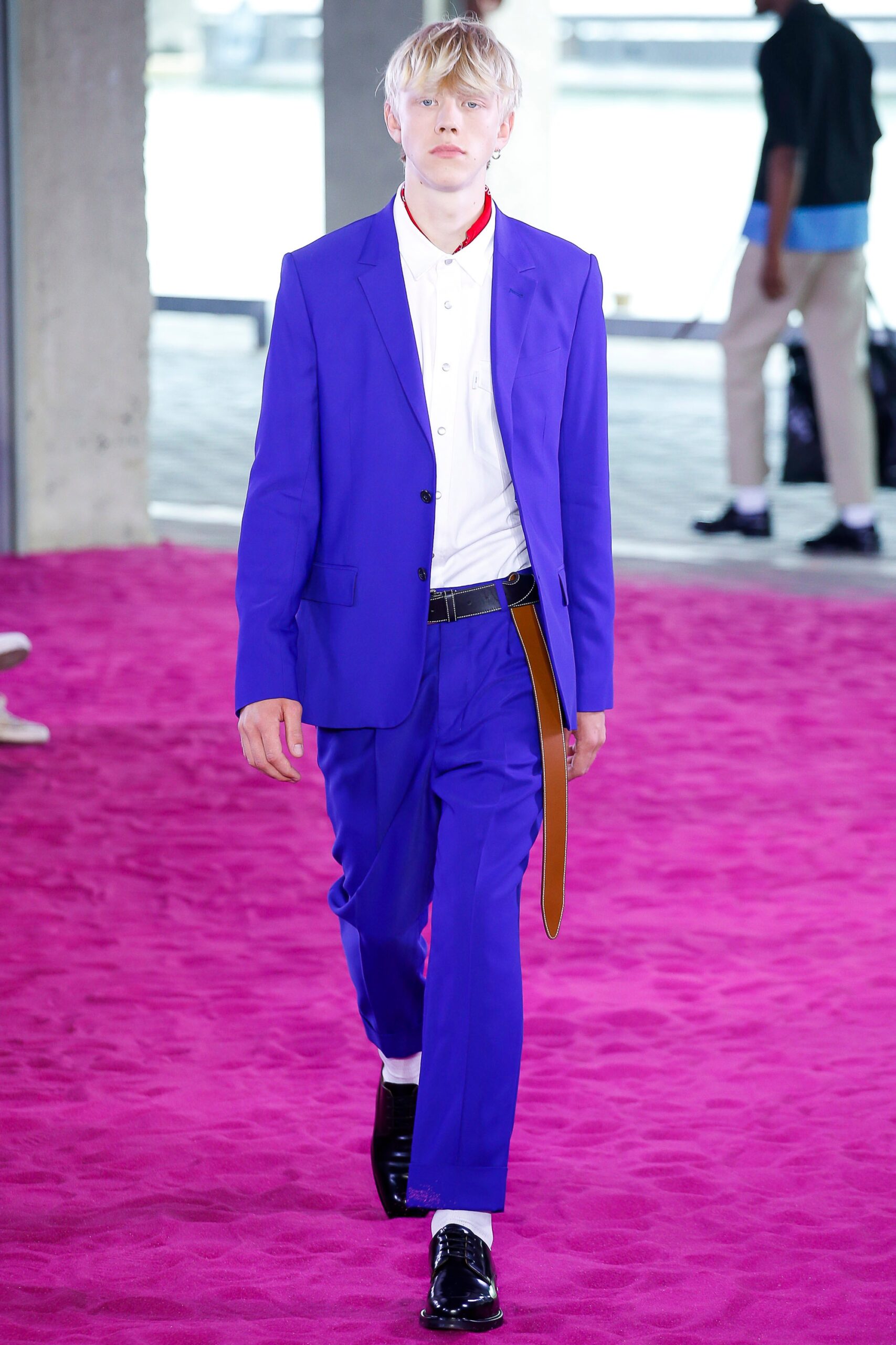 purple tailored suit with black shoes