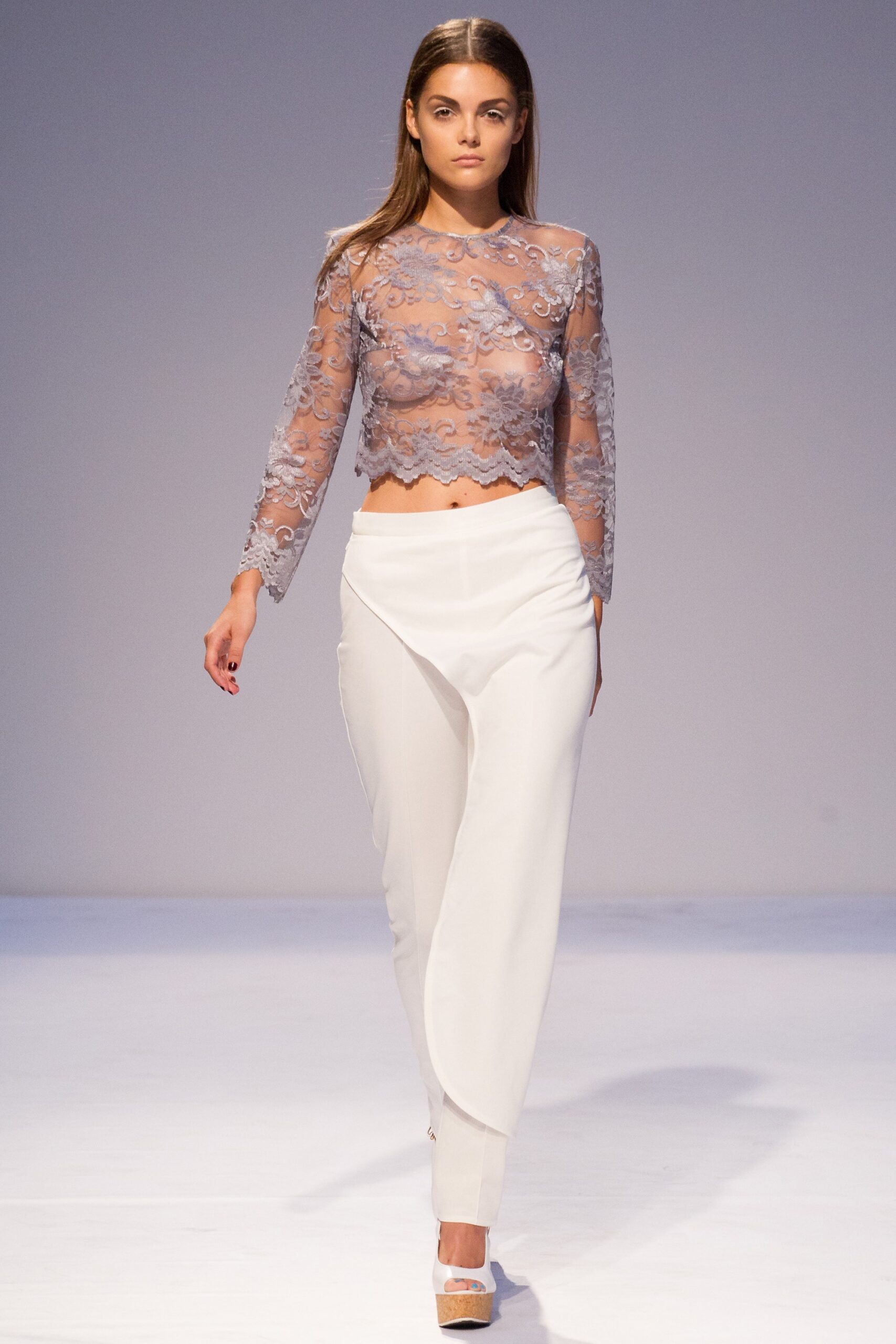 blue lace fitted top with white tailored pants