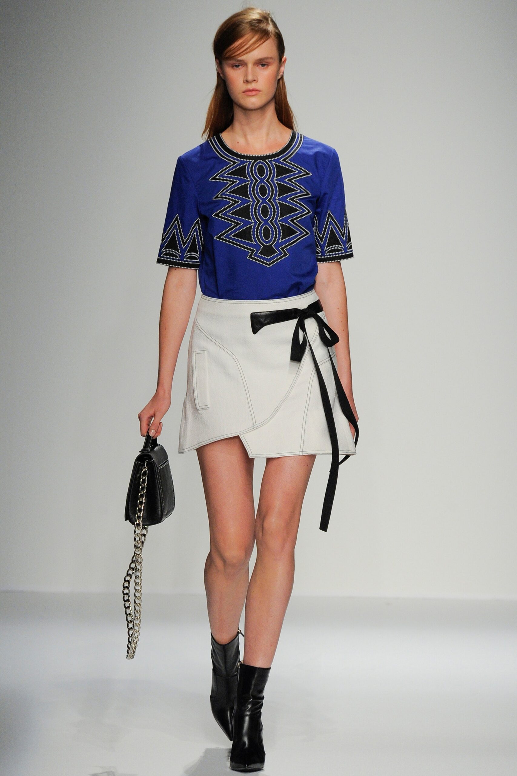 blue embroidered top with white skirt