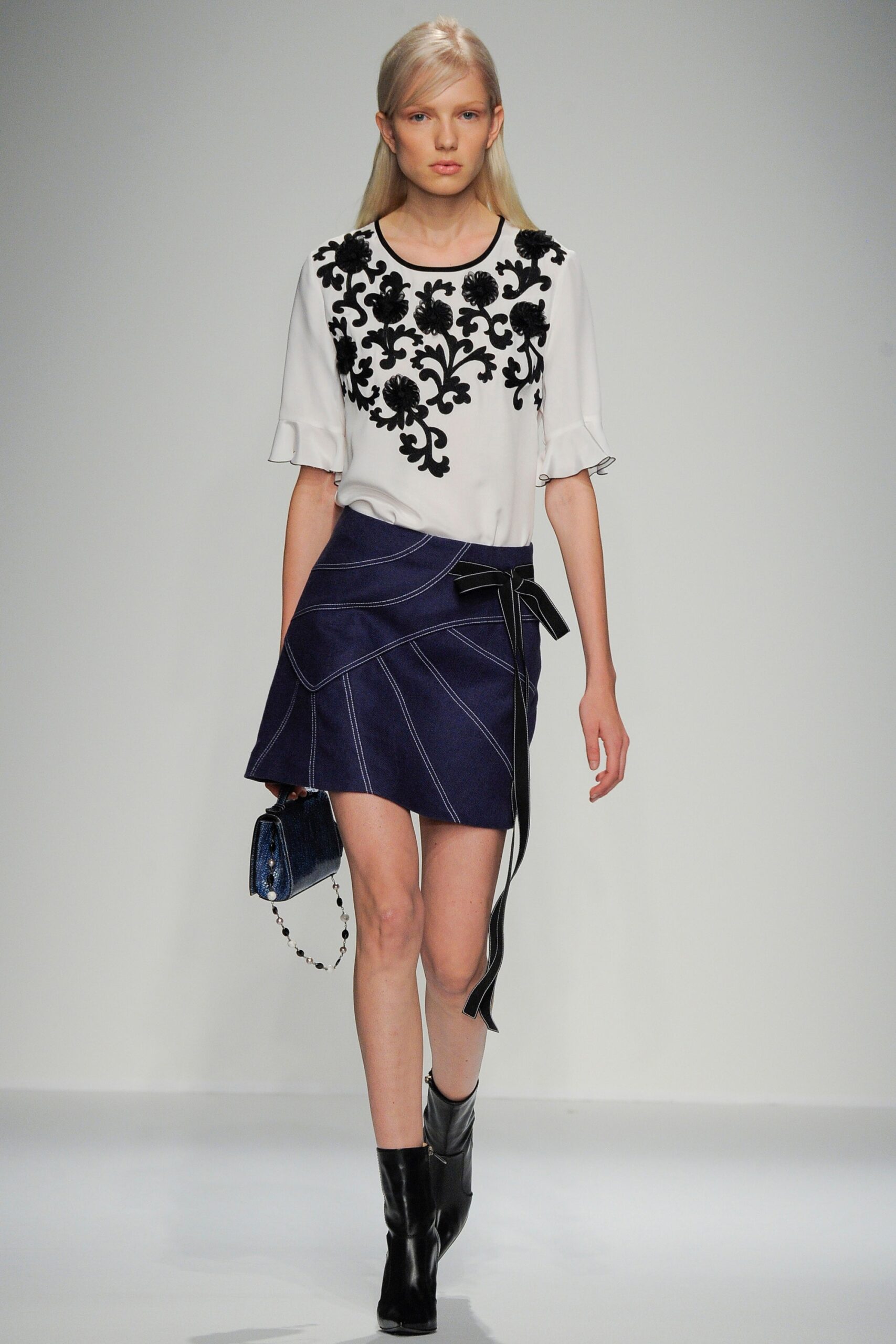 white embroidered top with blue skirt