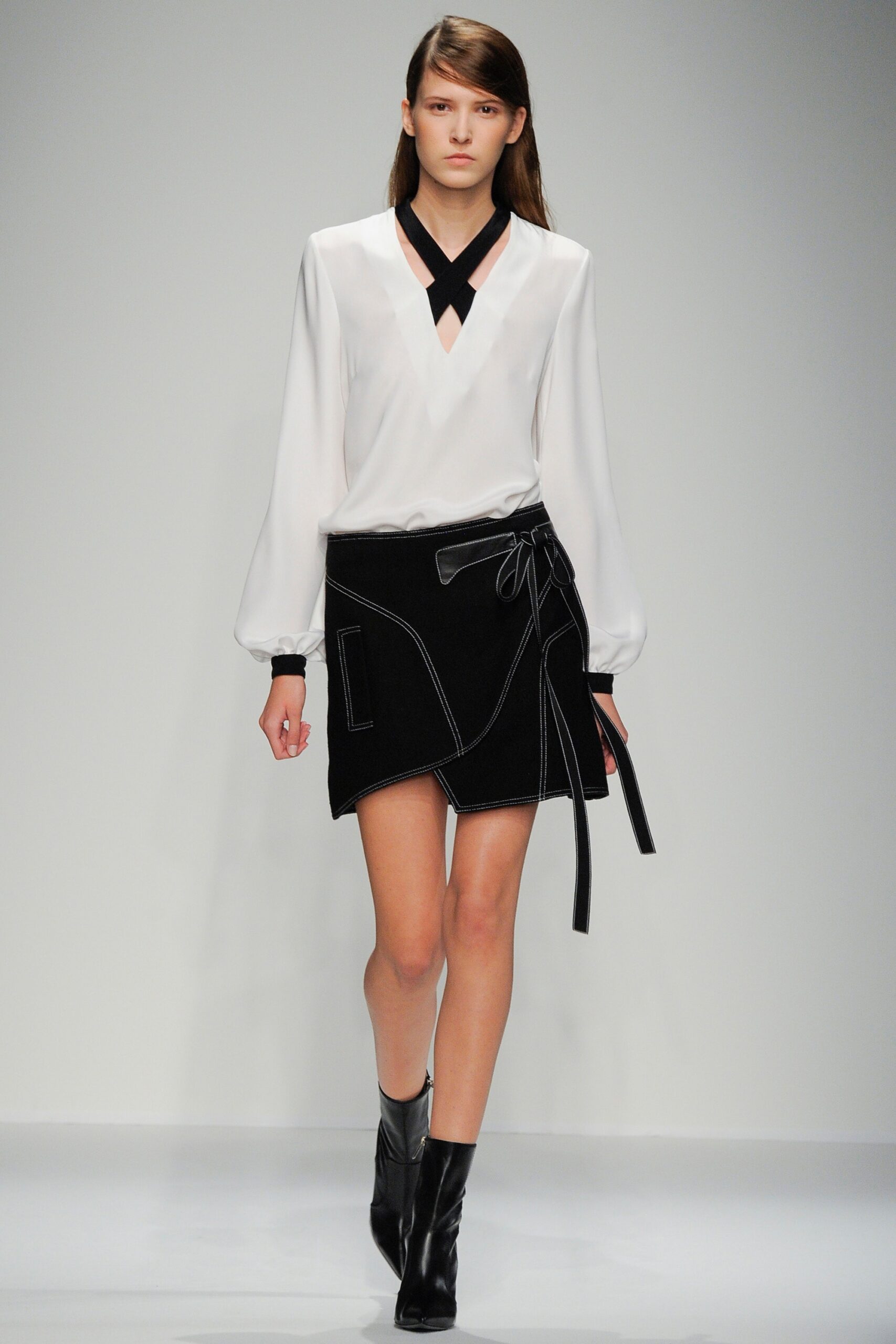 white silk blouse and black skirt