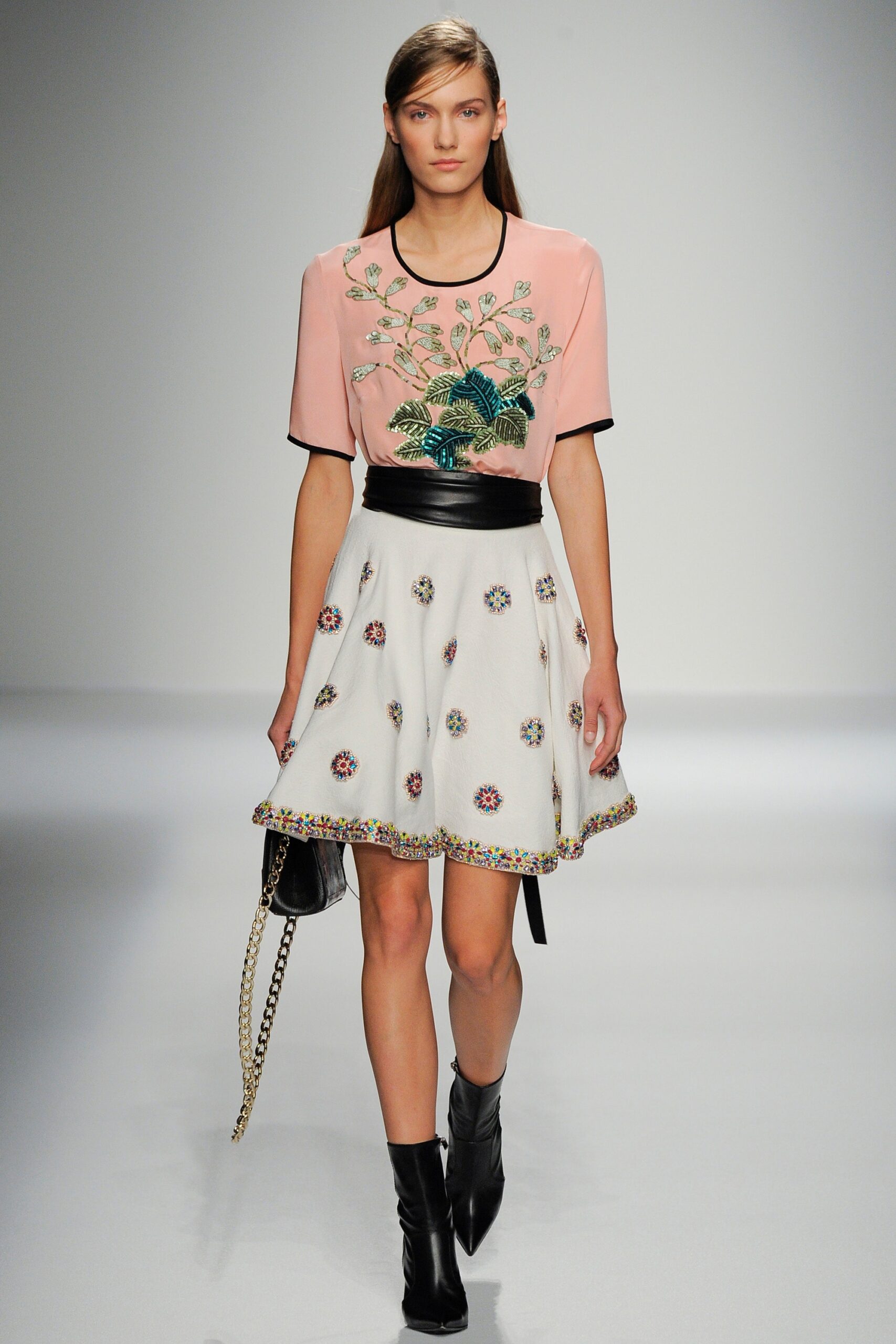 pink embroidered top with white skirt