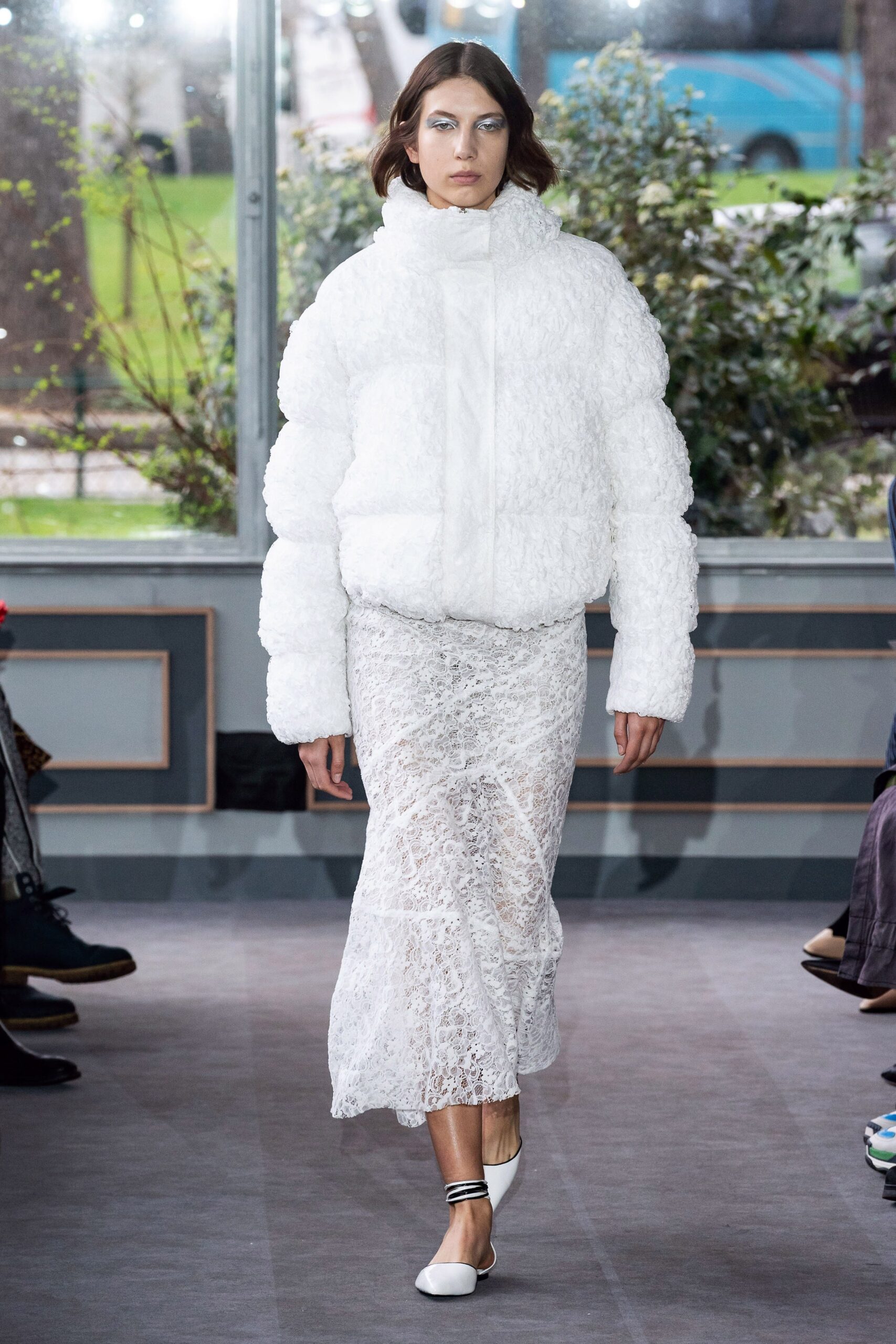 white oversized fur jacket and lace skirt