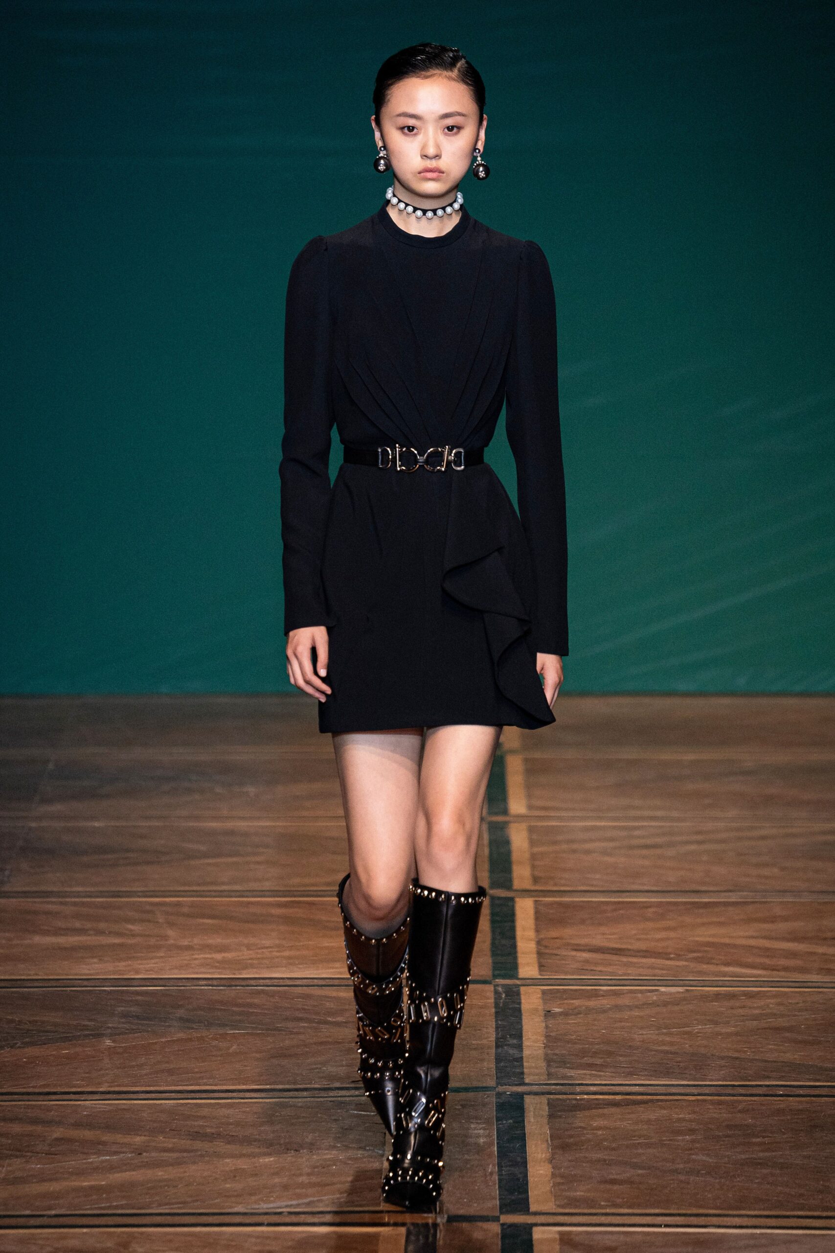 black fitted mini dress with boots