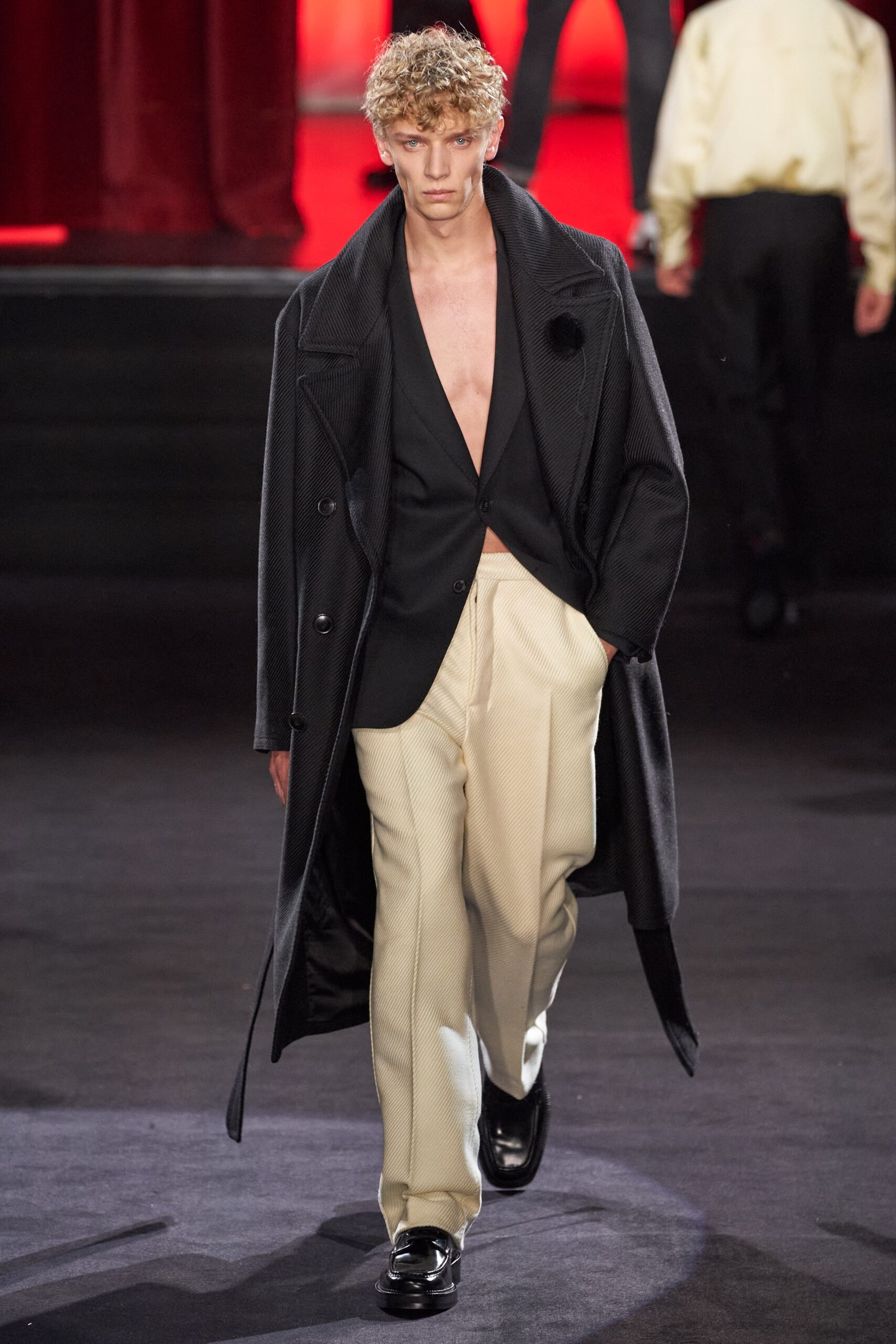 black wool coat and blazer with beige tailored pants
