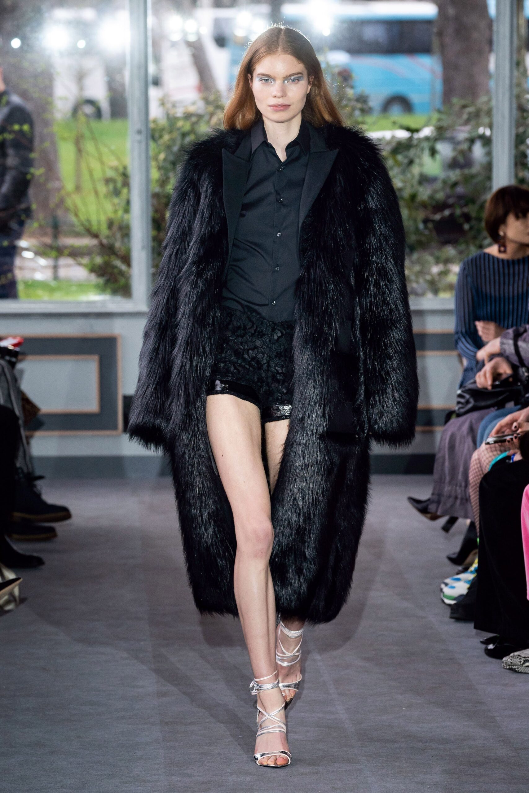 black fur coat with lace shorts