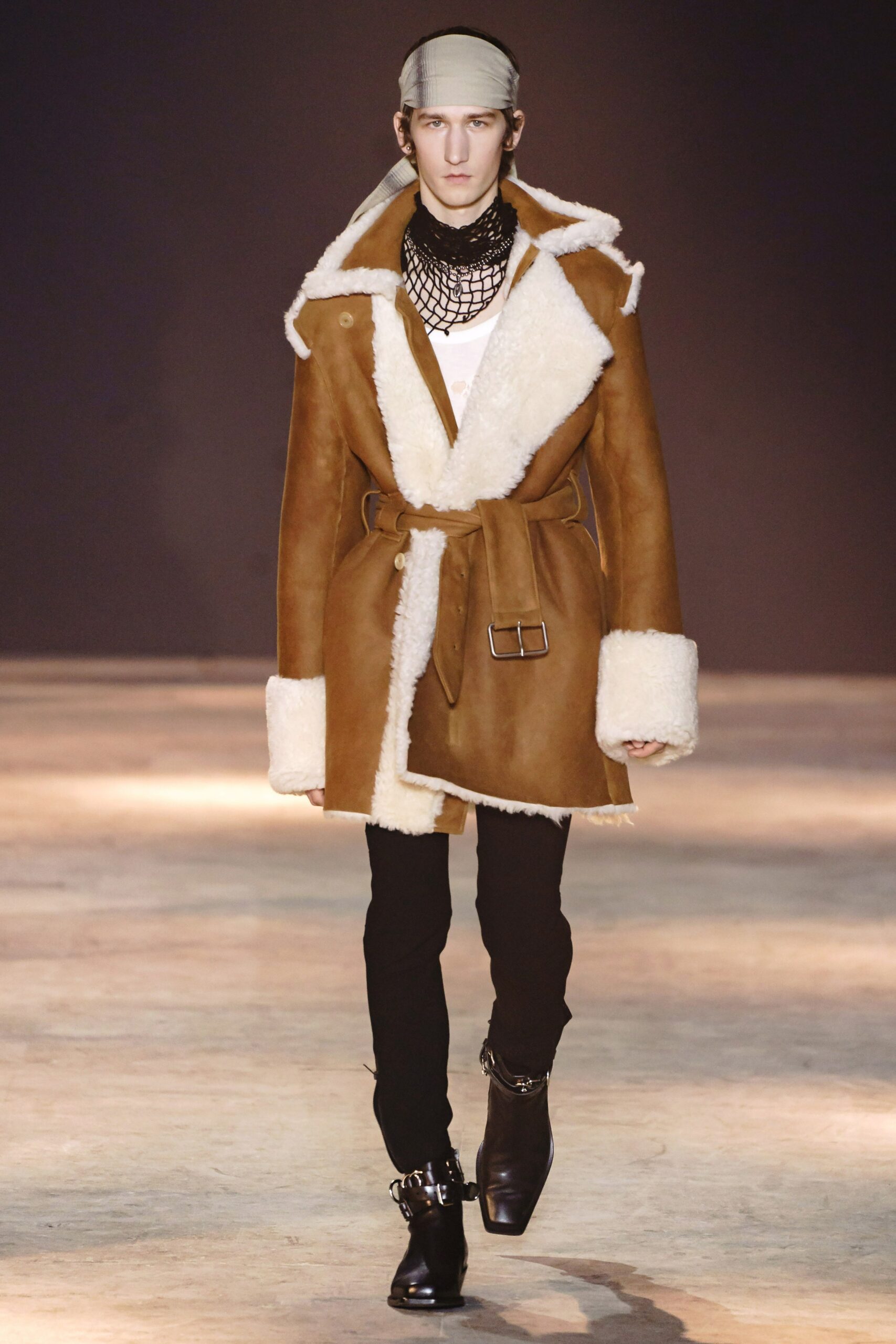 brown leather coat with black pants