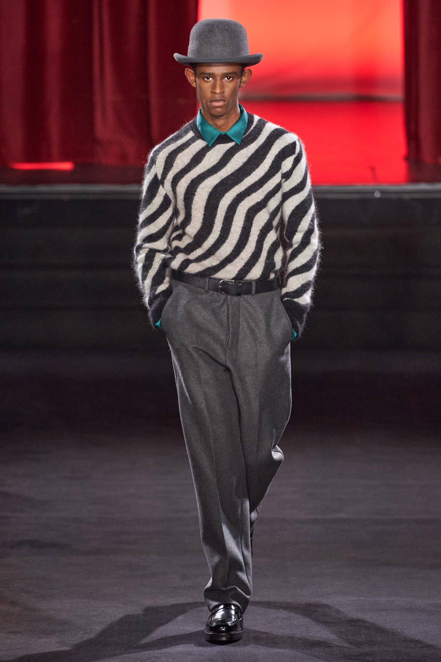 black and white striped sweater with gray pants