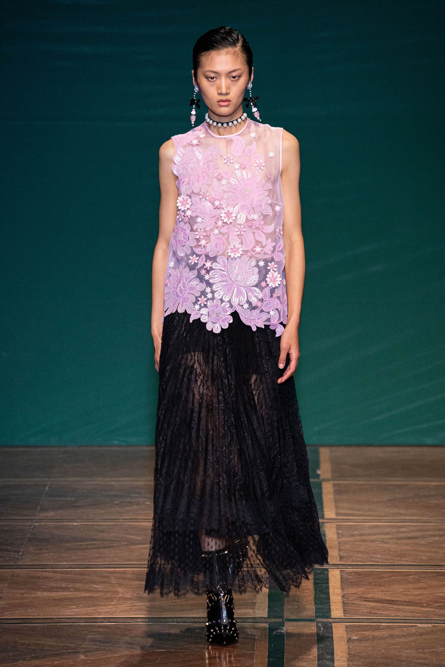 pink lace sleeveless top and black tiered skirt