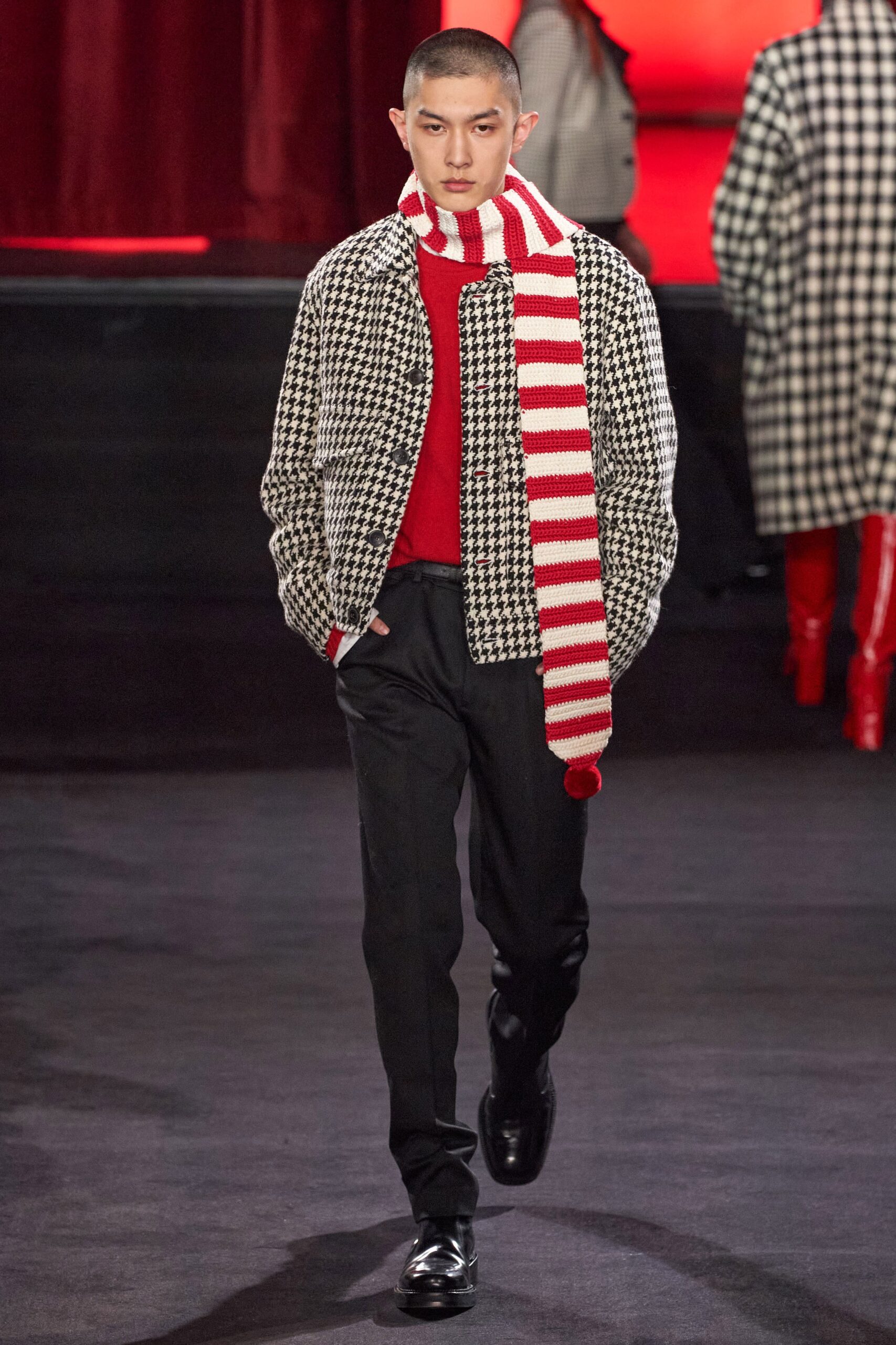 checked jacket with red sweater