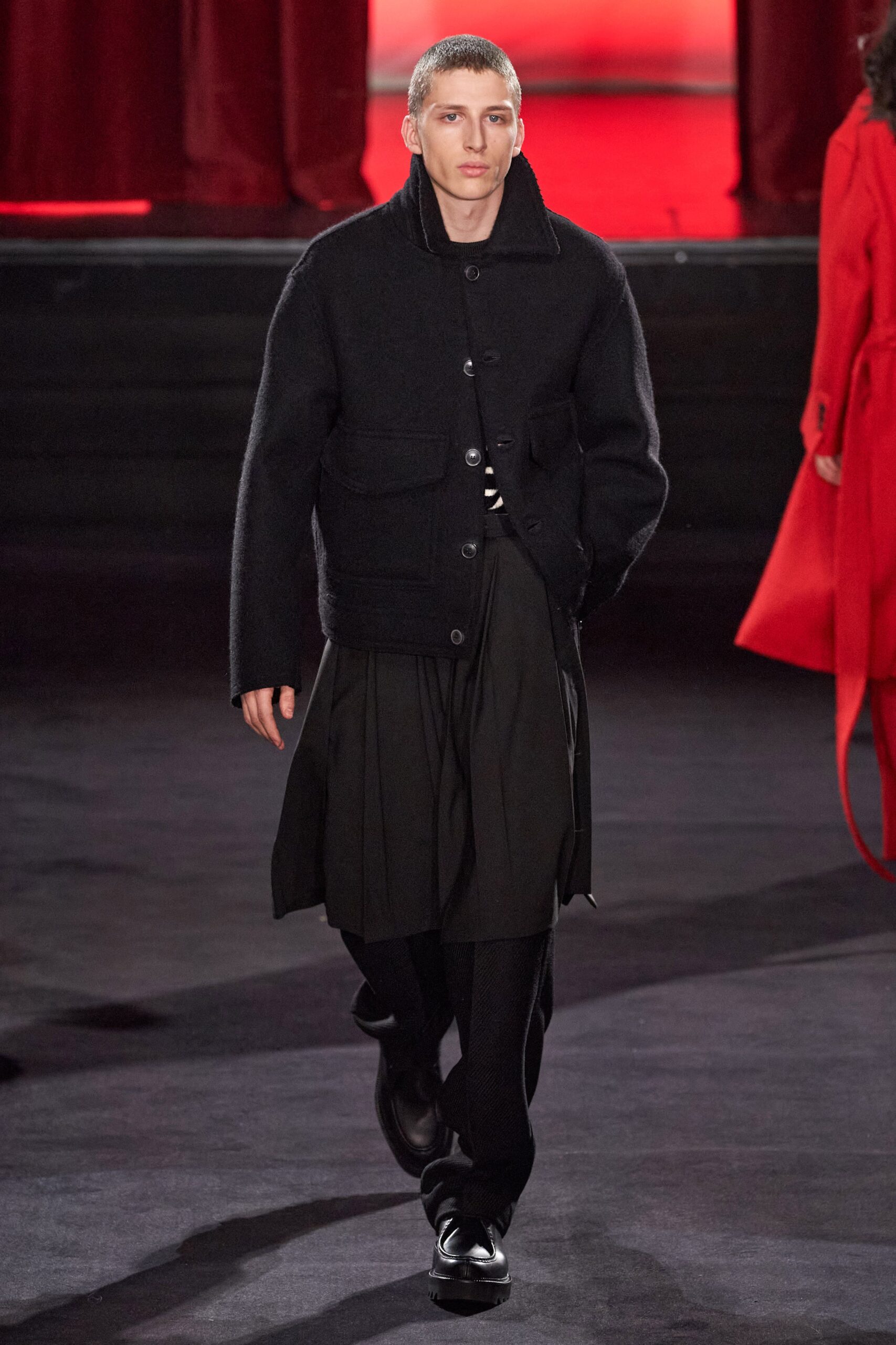 black wool jacket with pleated skirt