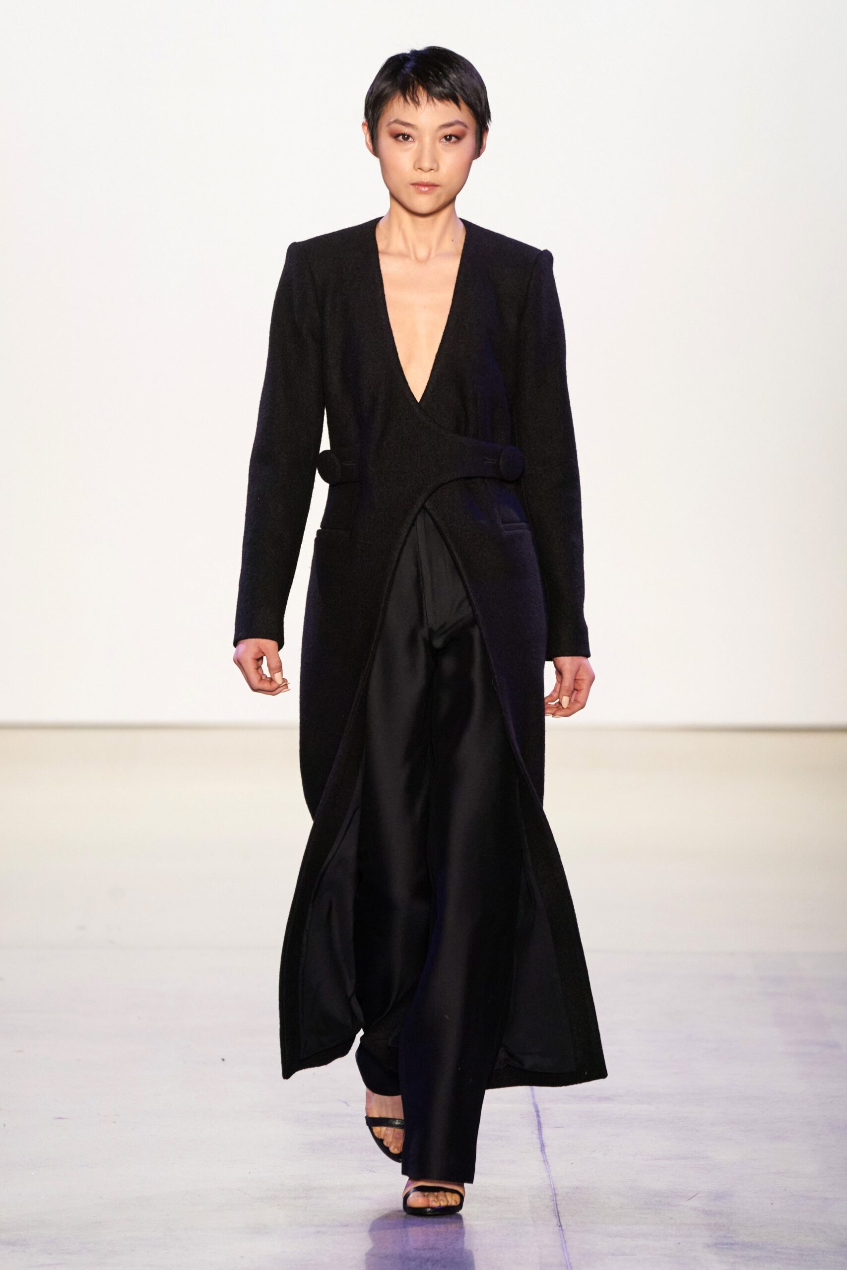 black wool coat and silk pants