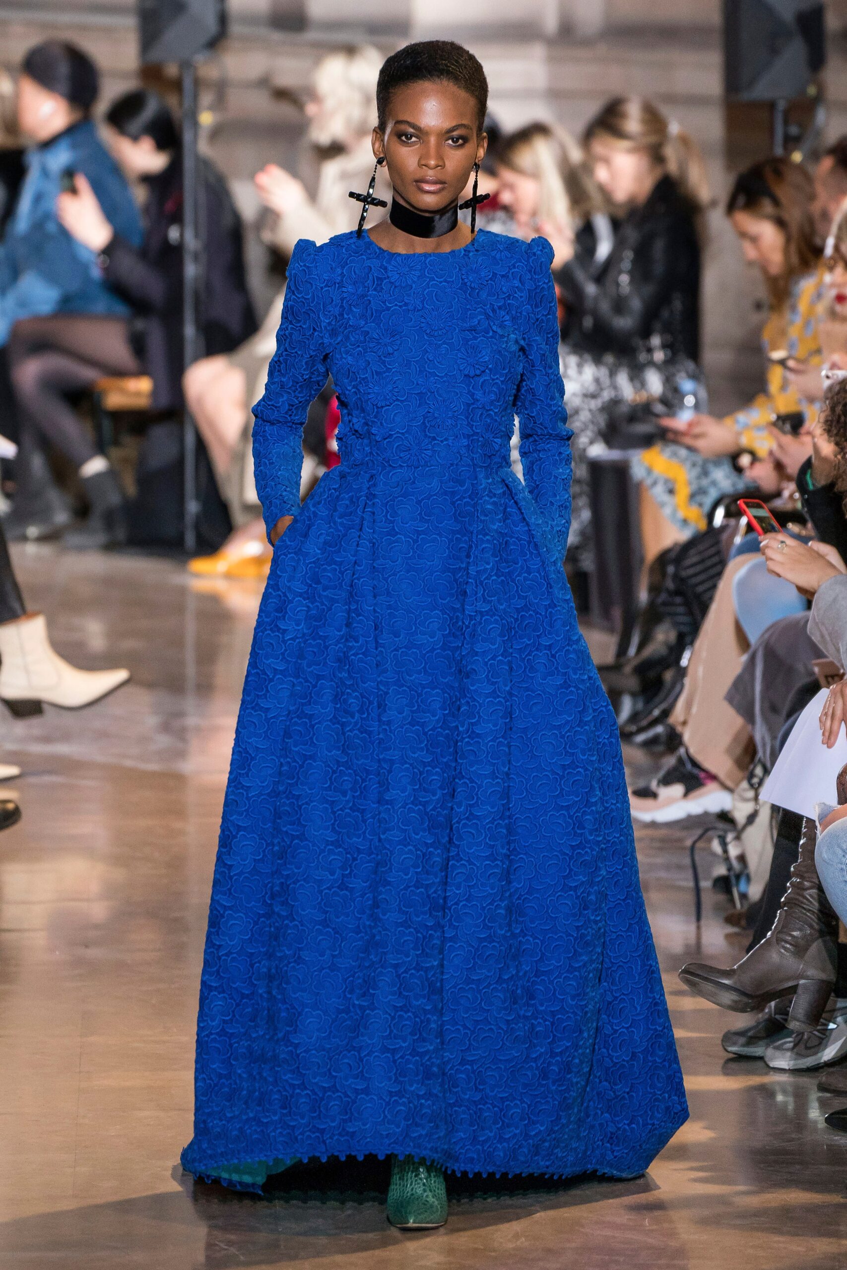 blue pleated long-sleeve gown