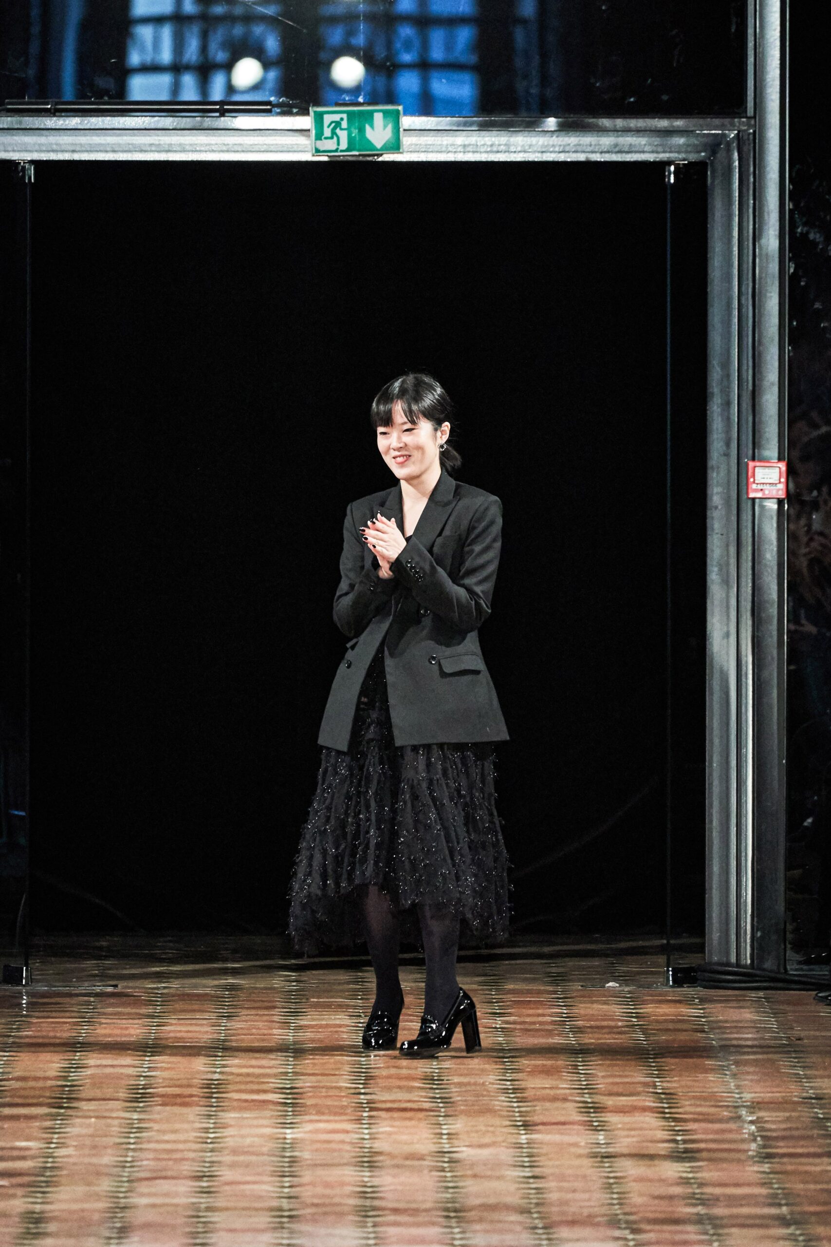black tailored blazer and tiered skirt