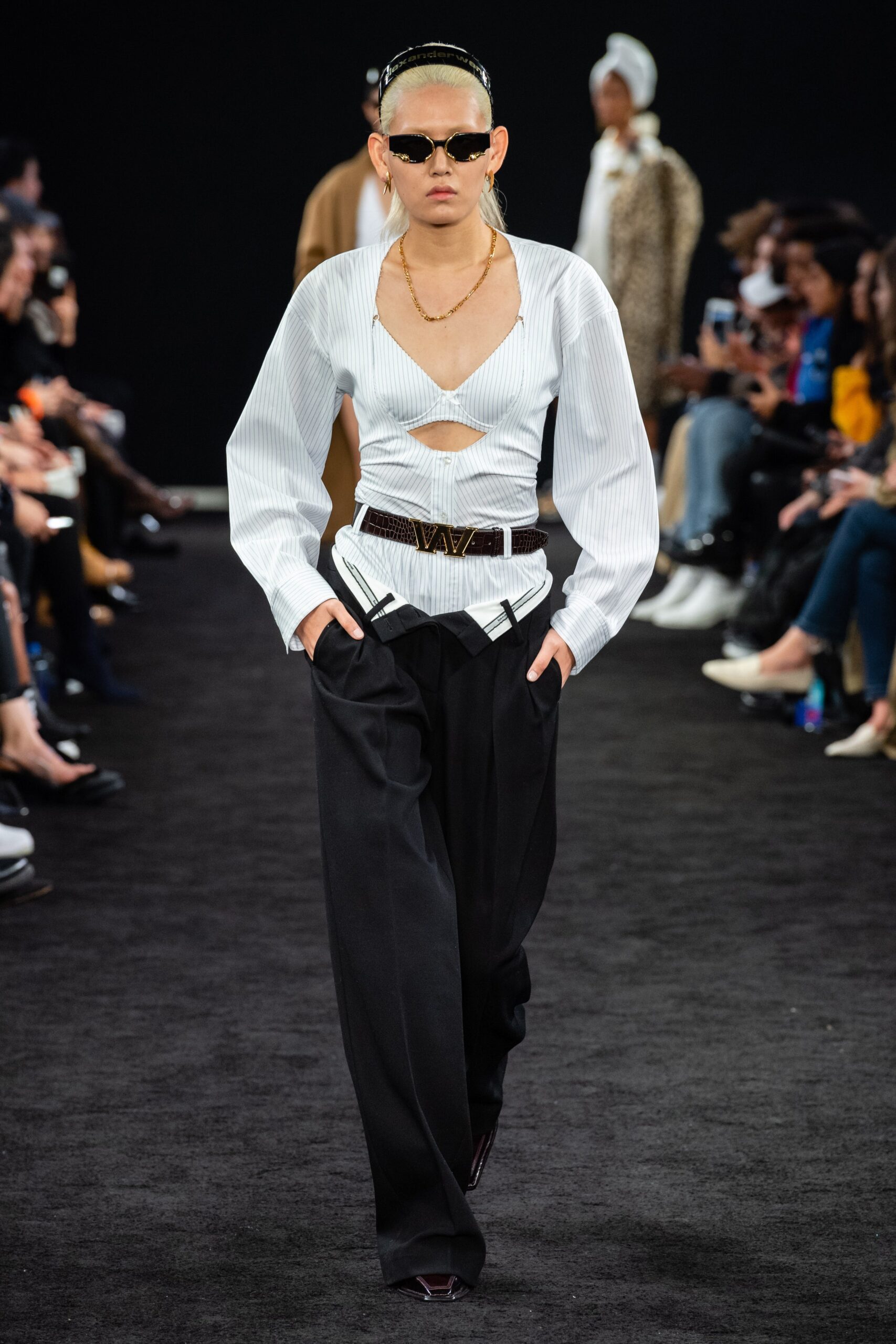 fitted white blue top with black pants