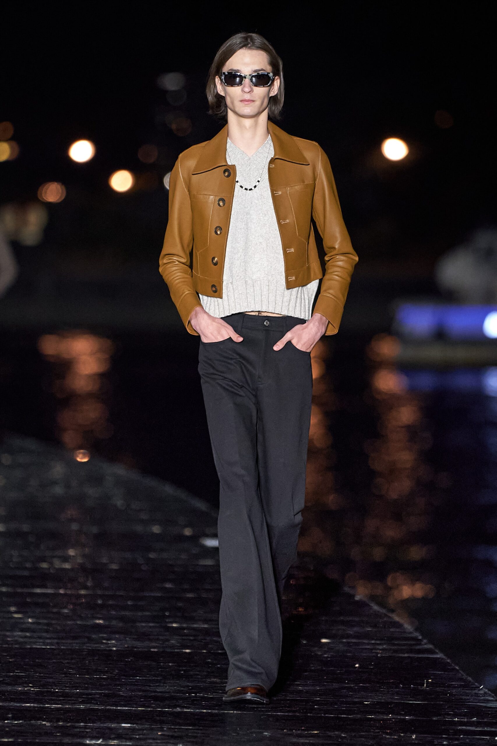 brown leather jacket gray sweater black pants