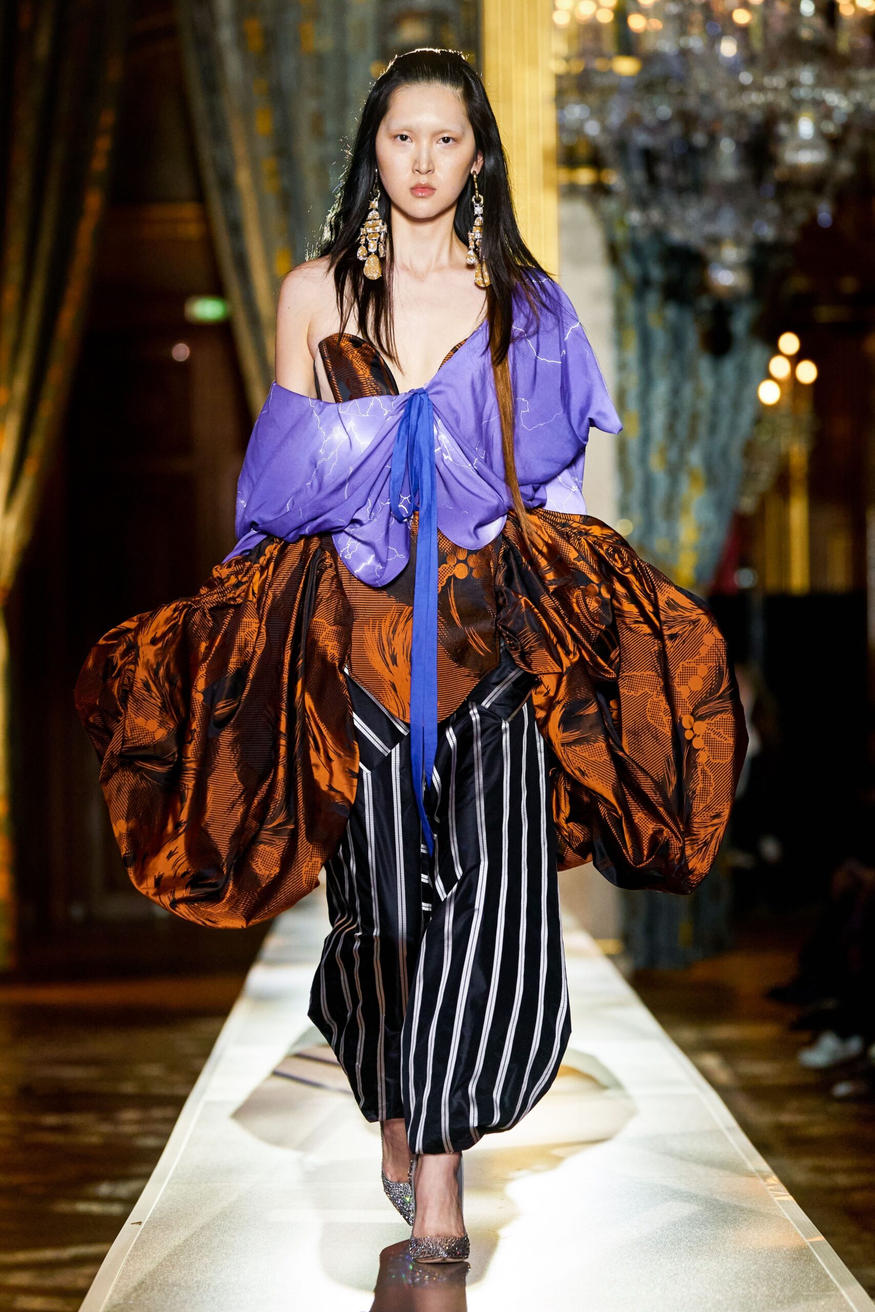 brown and purple draped midi dress with striped pants