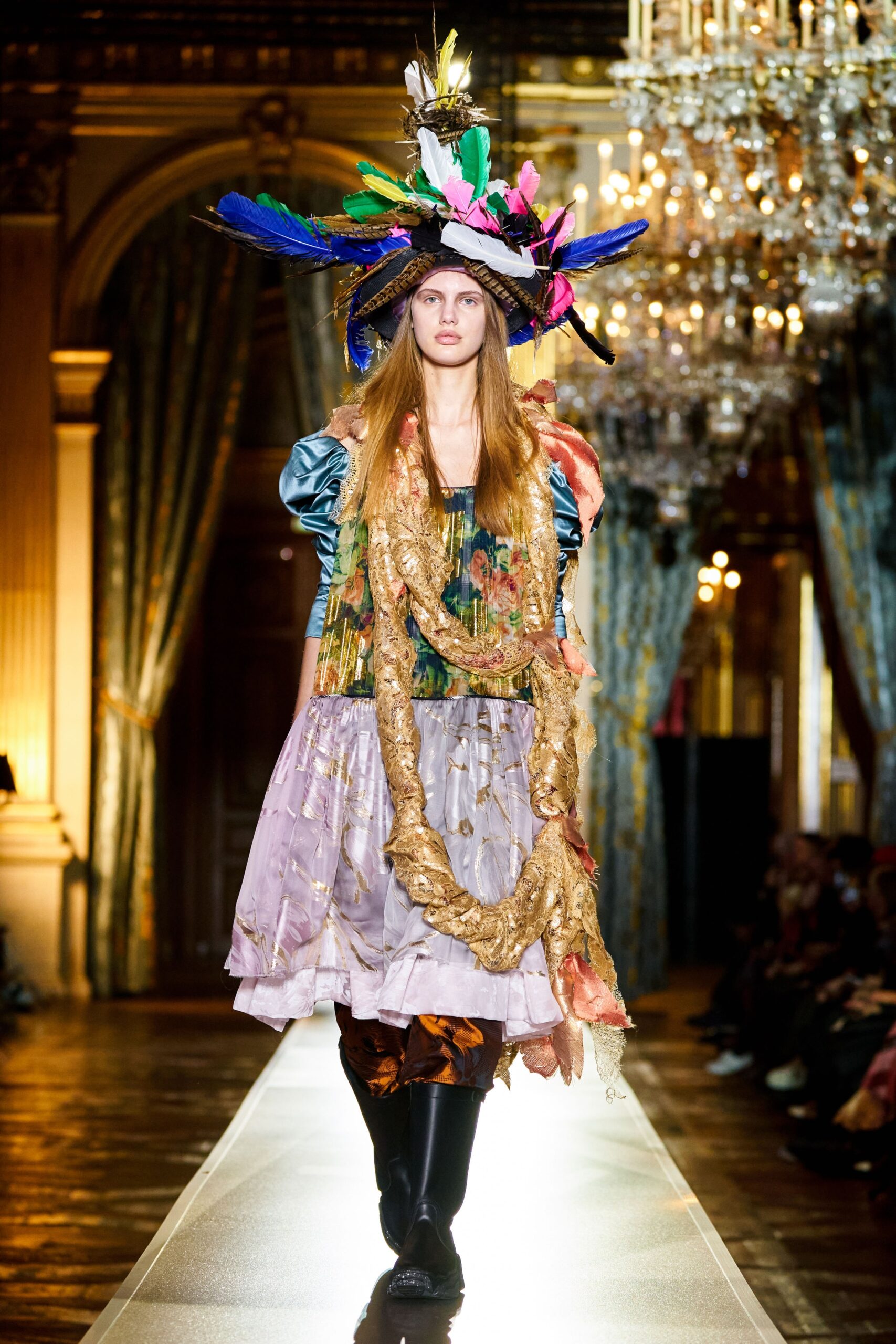 purple layered midi dress with feathered hat