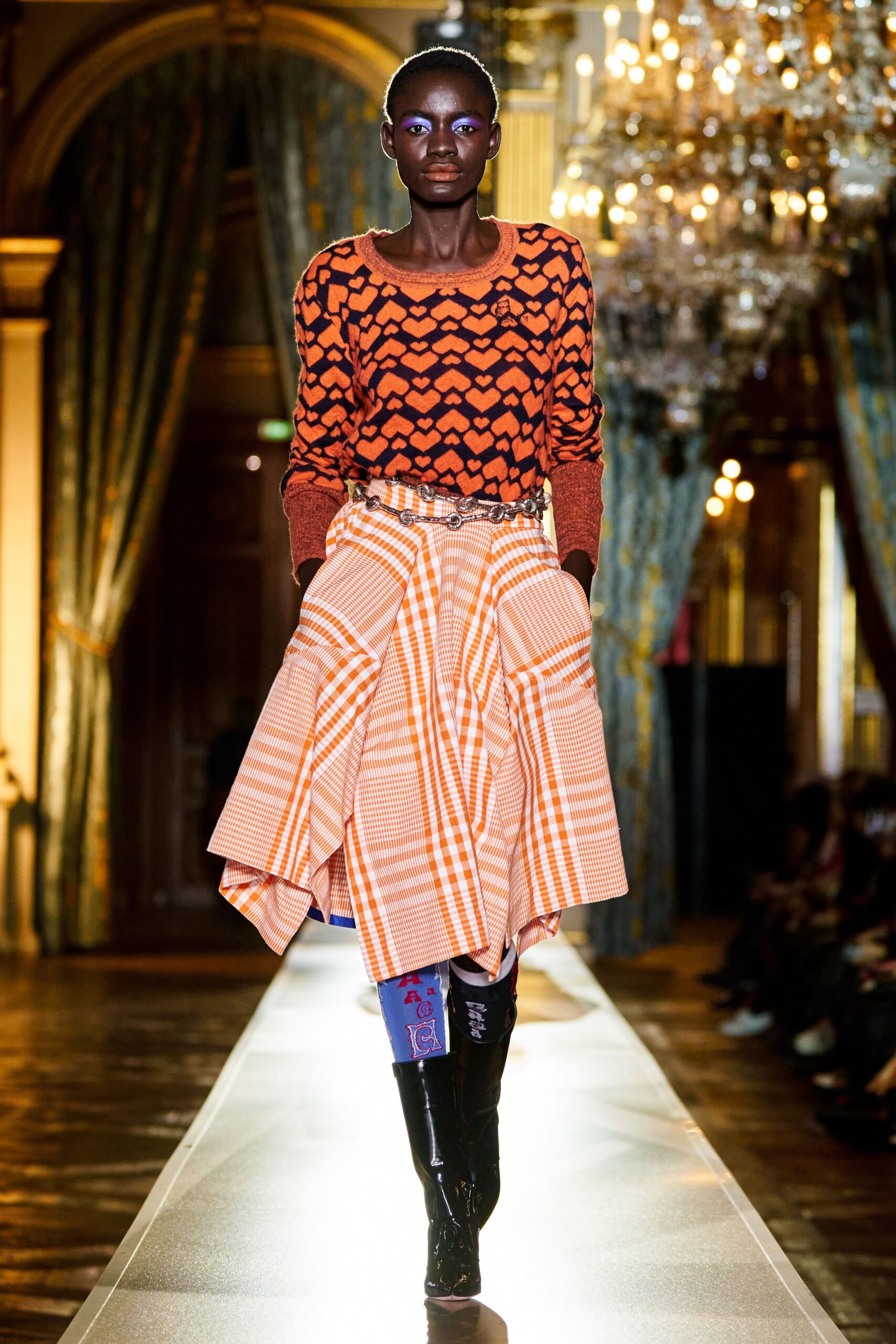 fitted orange top with pleated skirt