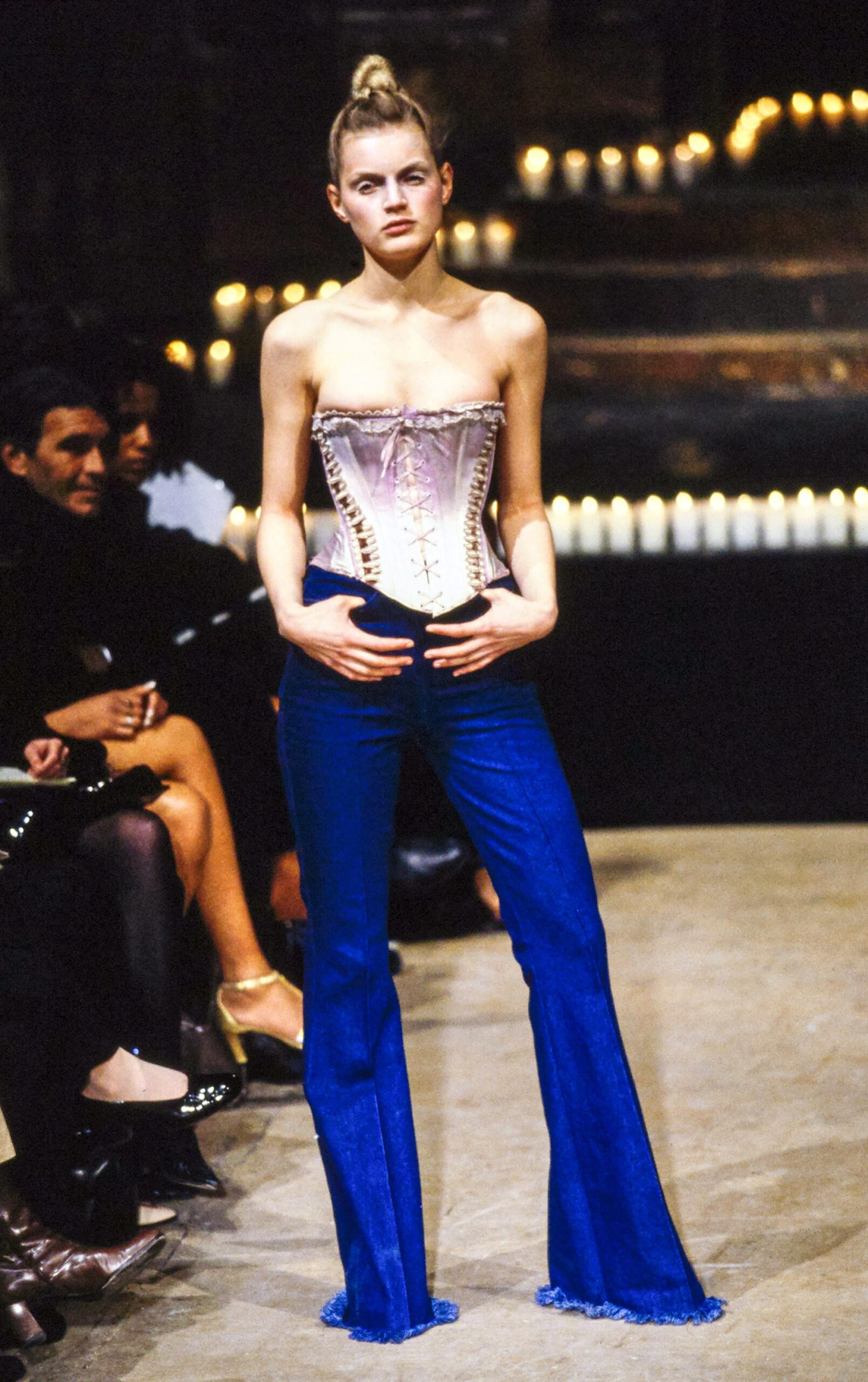 pink silk corset and blue flared pants
