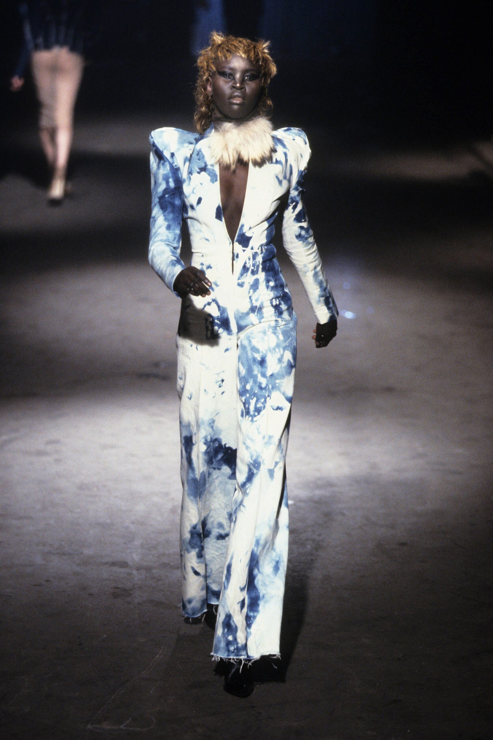 blue and white printed jumpsuit with fur neckpiece
