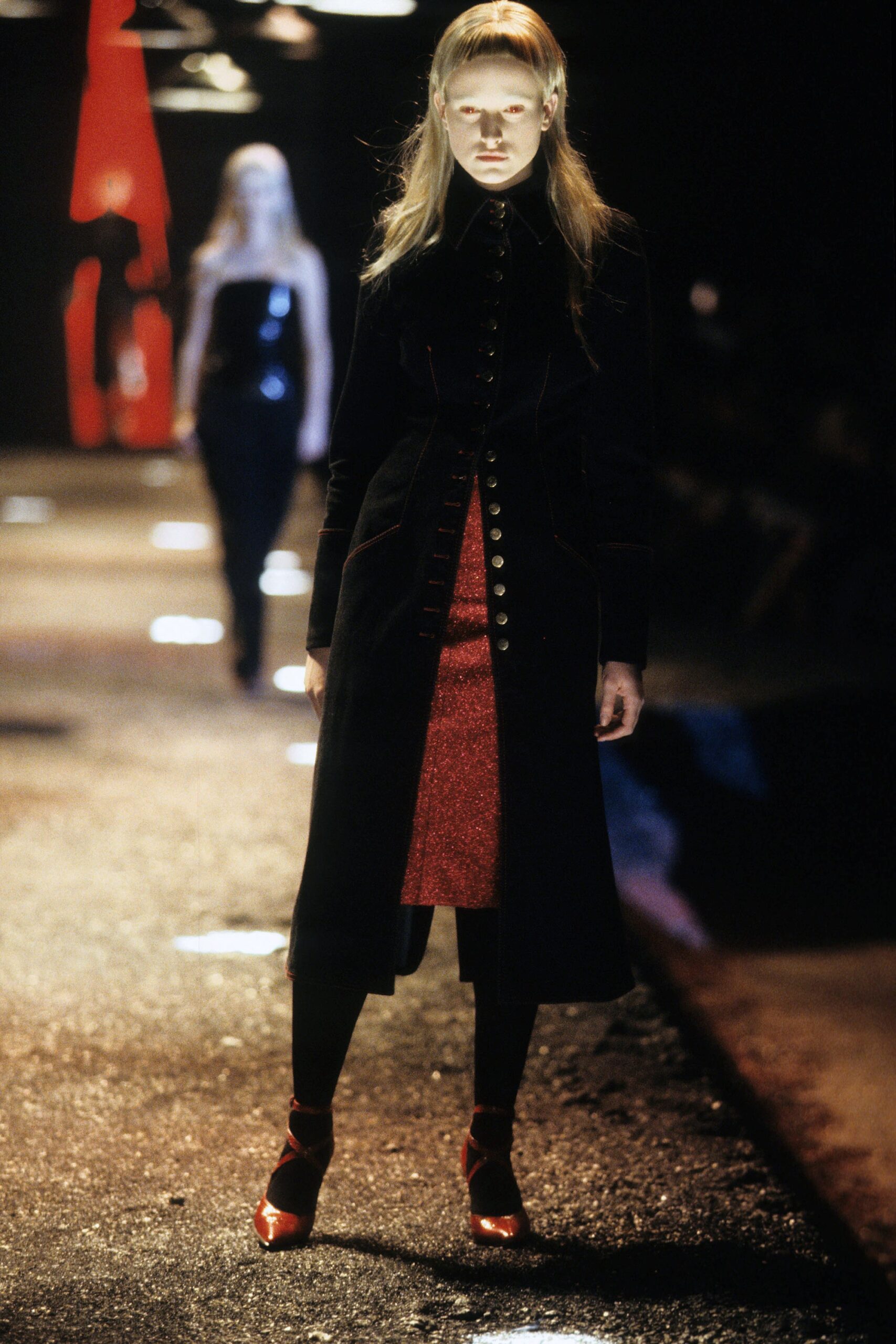black wool coat and red dress