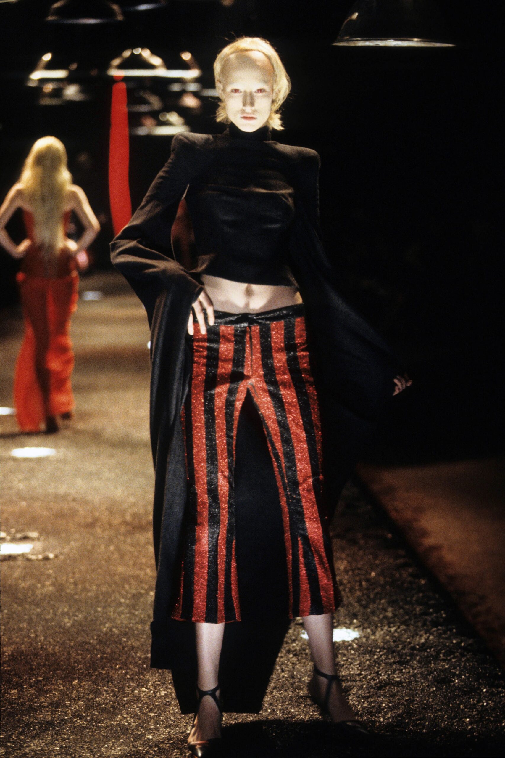 black fitted blazer with red striped skirt