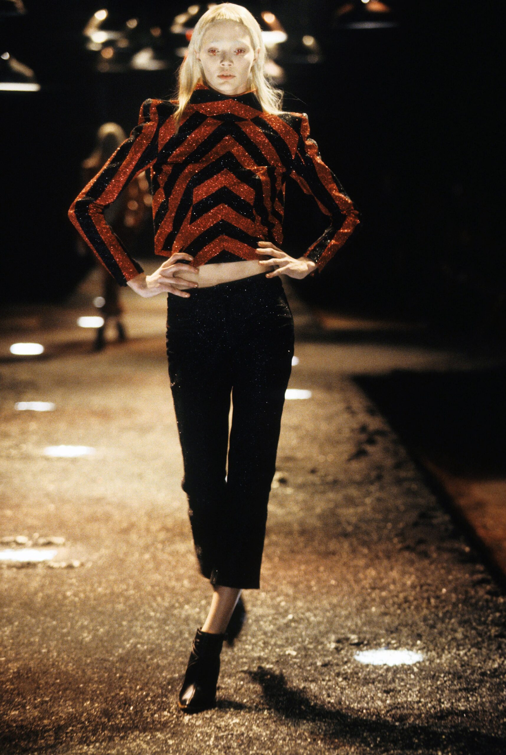 red and black sequined top with slim pants