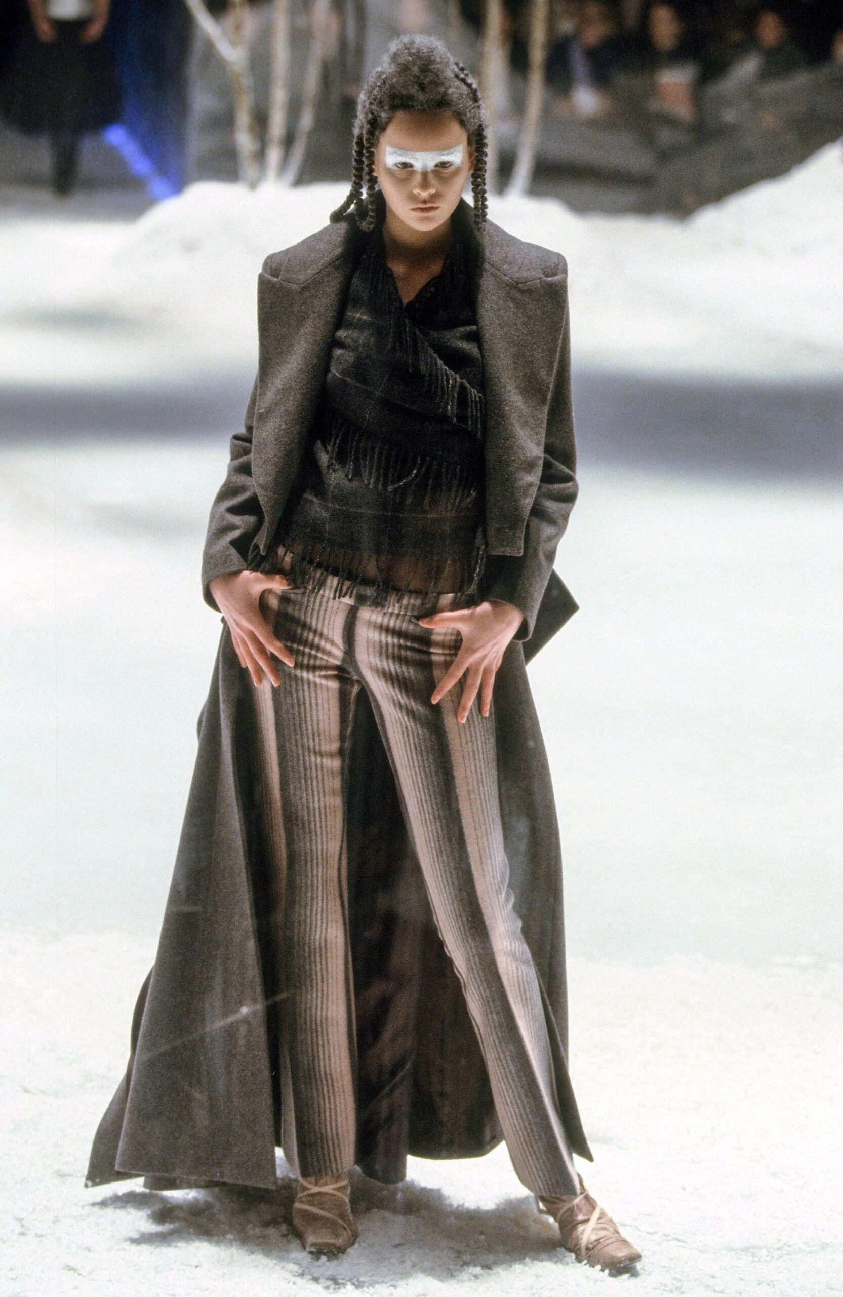 black wool fitted coat and gray striped pants