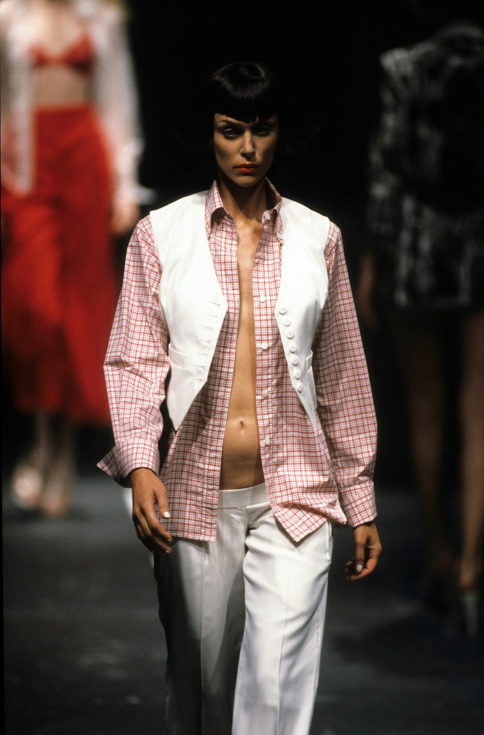 white sleeveless fitted buttoned vest