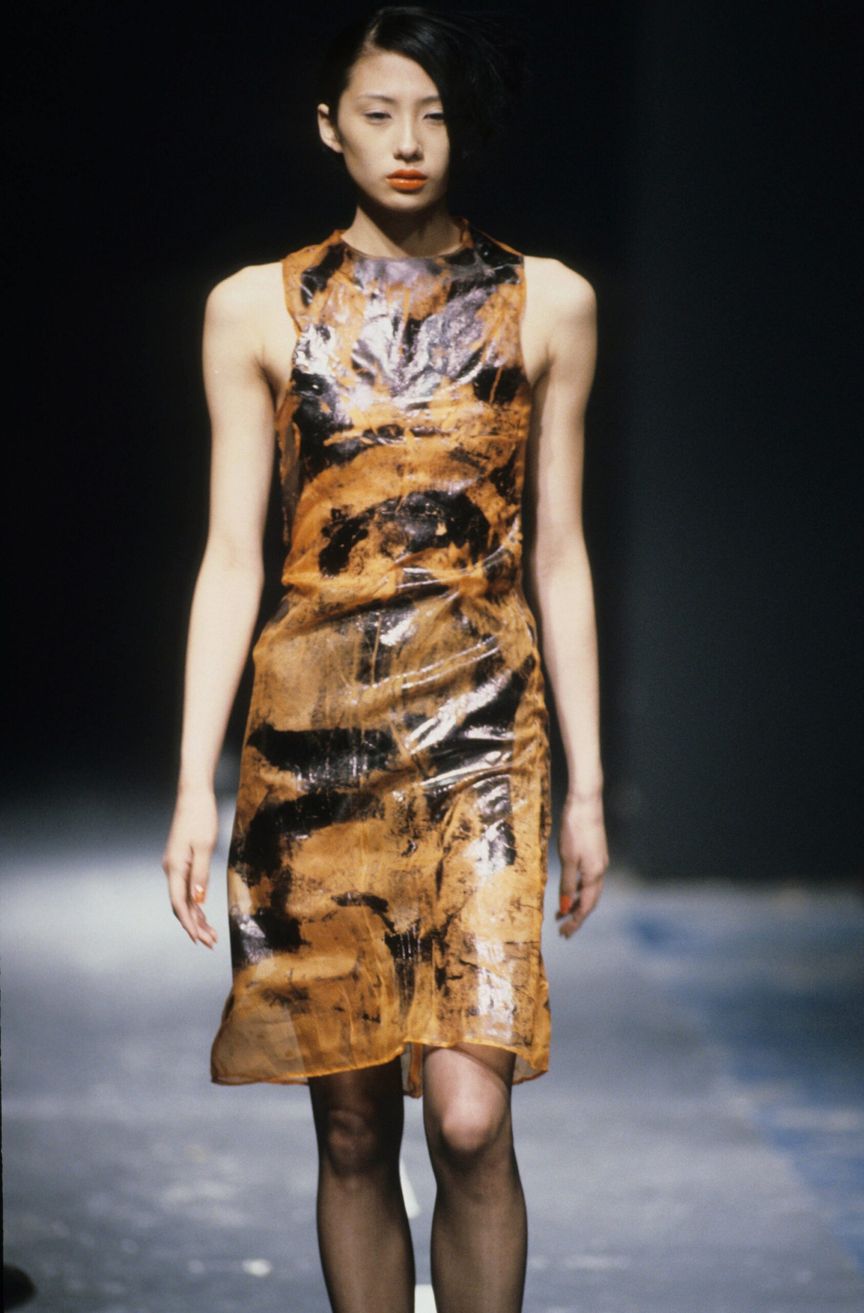 fitted orange and black vinyl dress