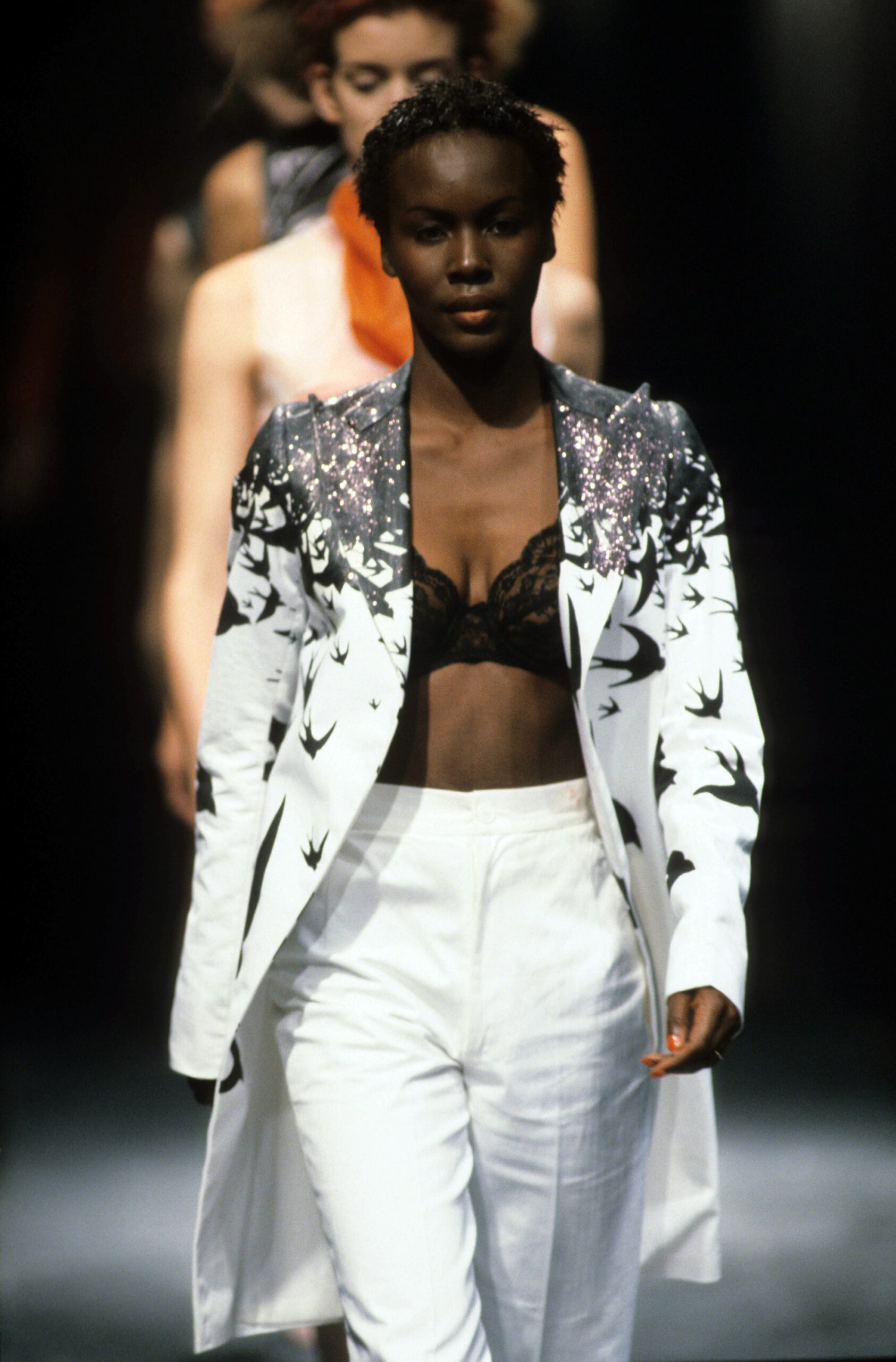 white blazer with black lace bra