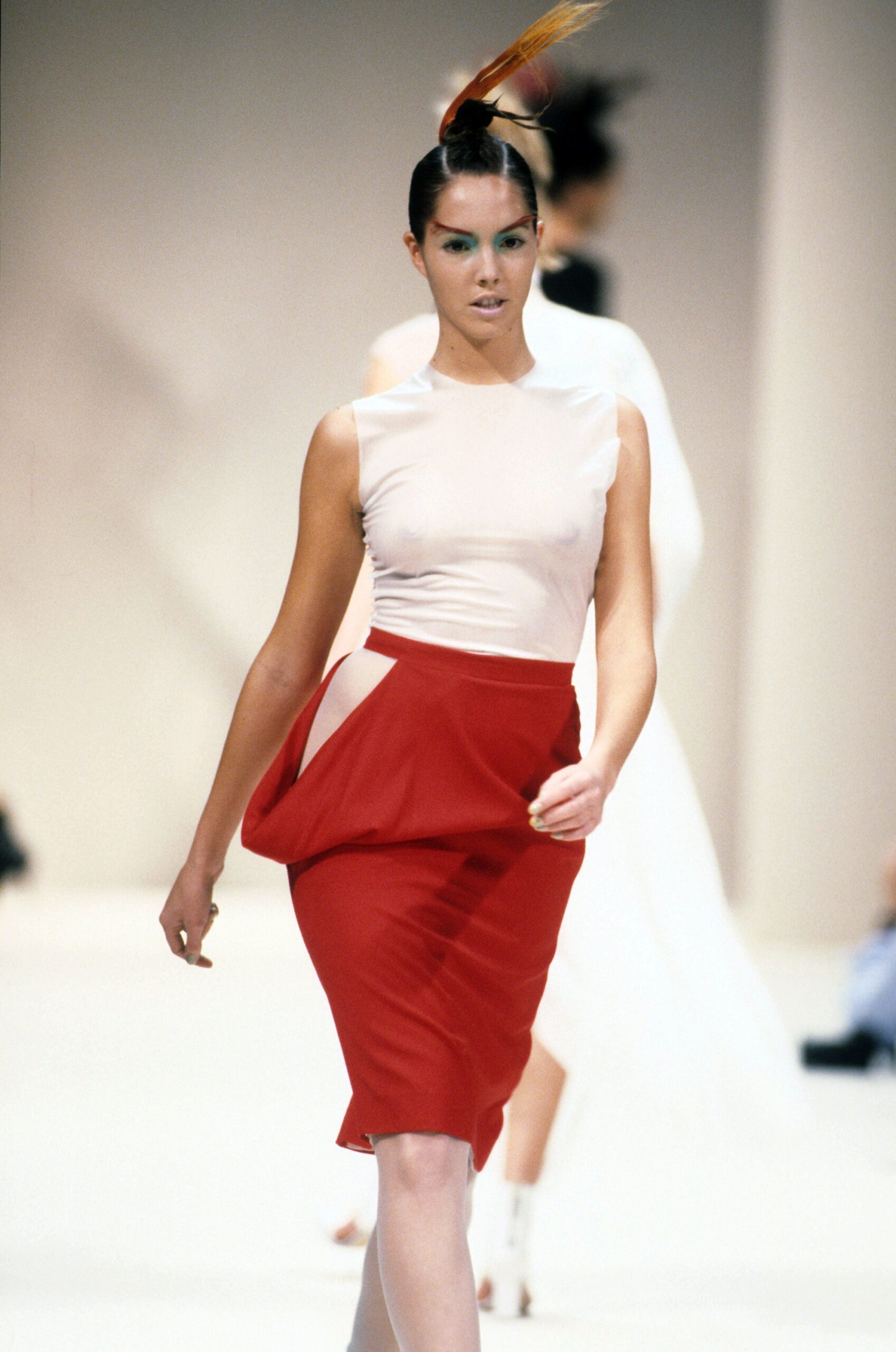 beige silk sleeveless top and red pencil skirt