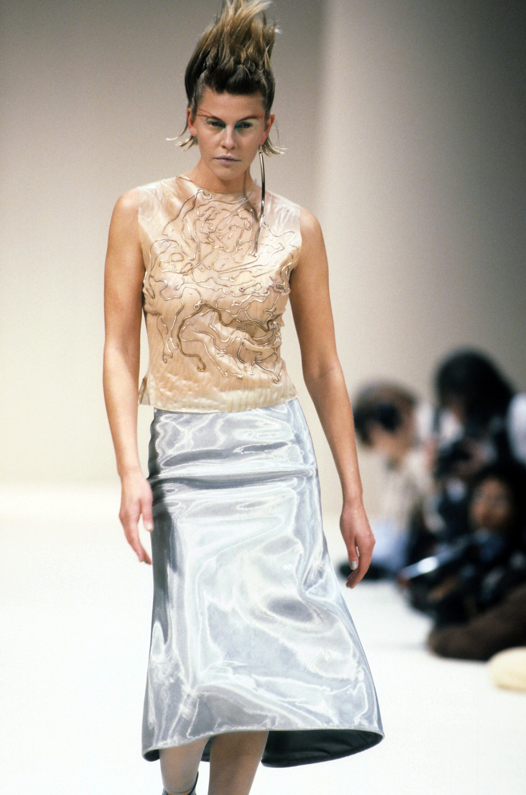 beige embroidered silk top and silver satin skirt